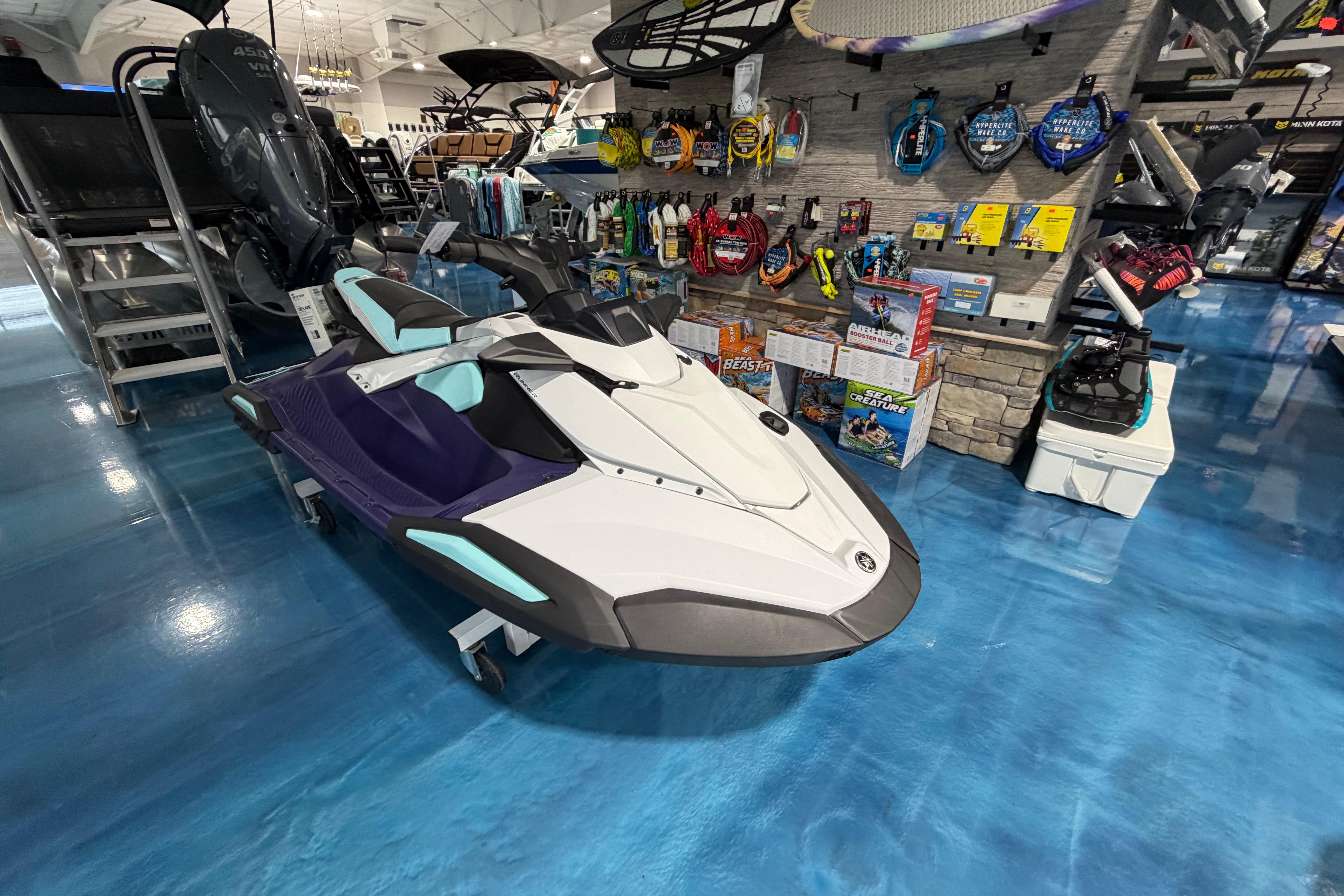 2025 Yamaha WaveRunner JetBlaster displayed in a showroom with accessories.