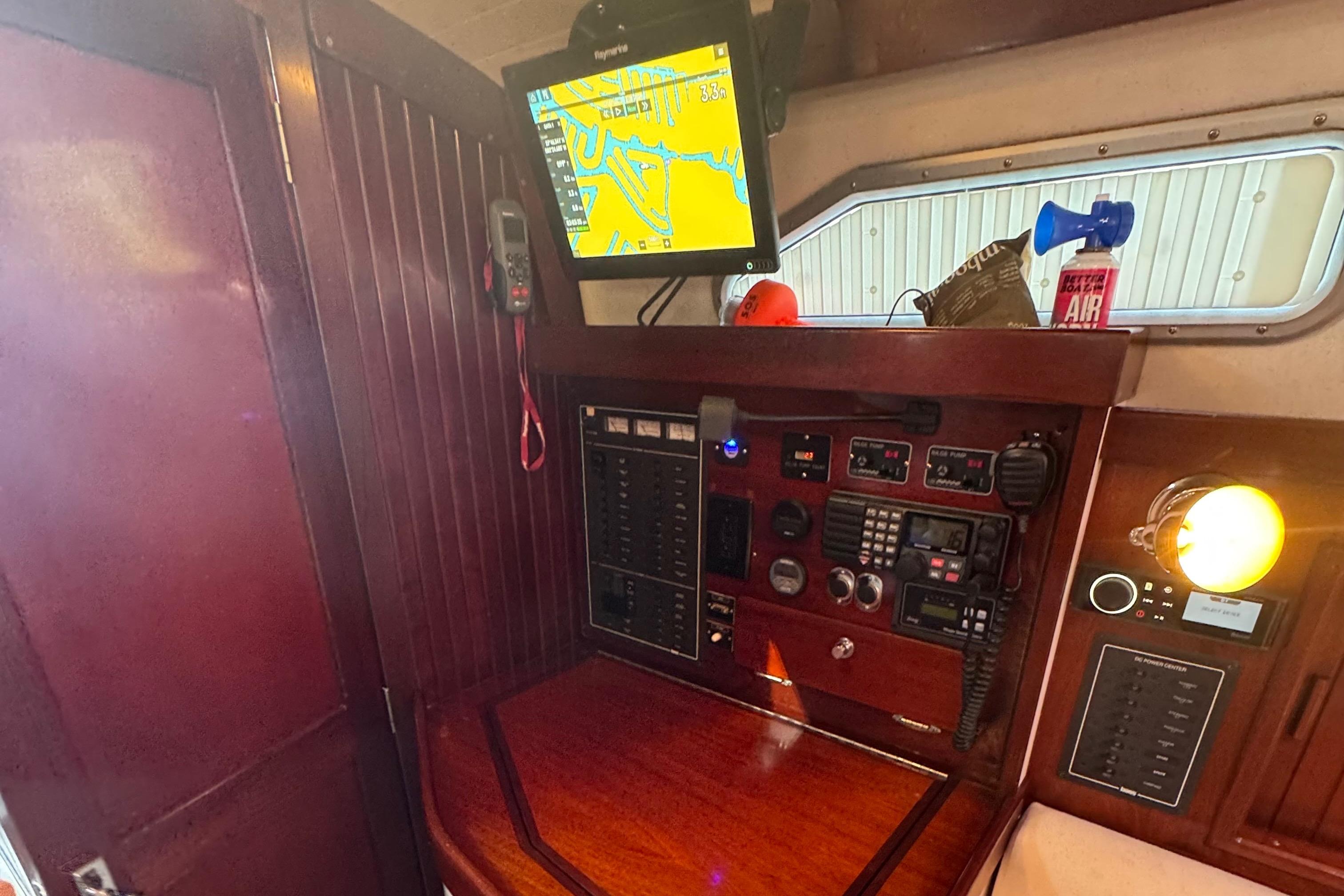 Navigation station of a 2006 Shannon Shoalsailer with electronic equipment and chart display.