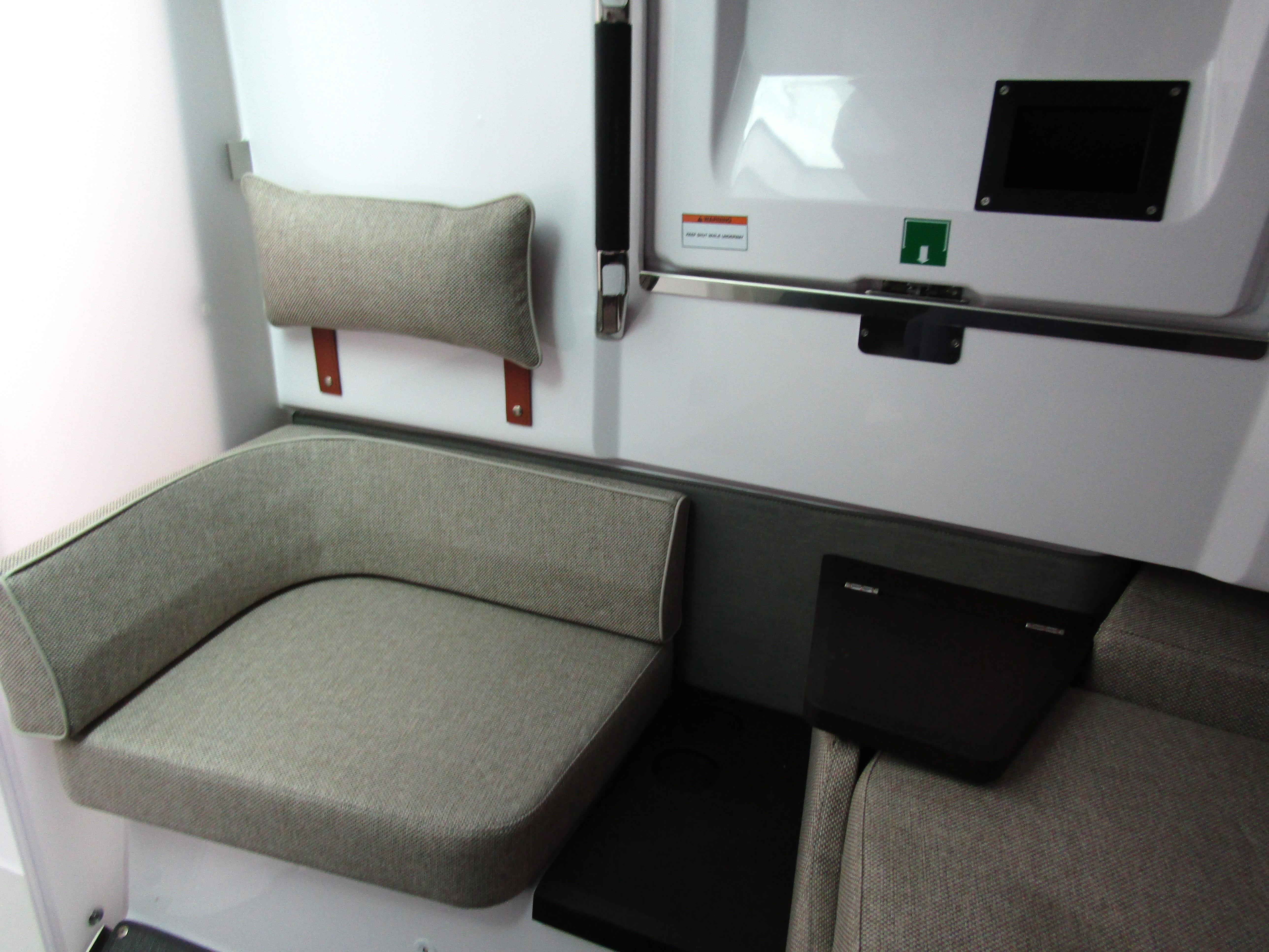 2024 Axopar 37 Sun Top interior seating area with modern design and comfortable cushions.