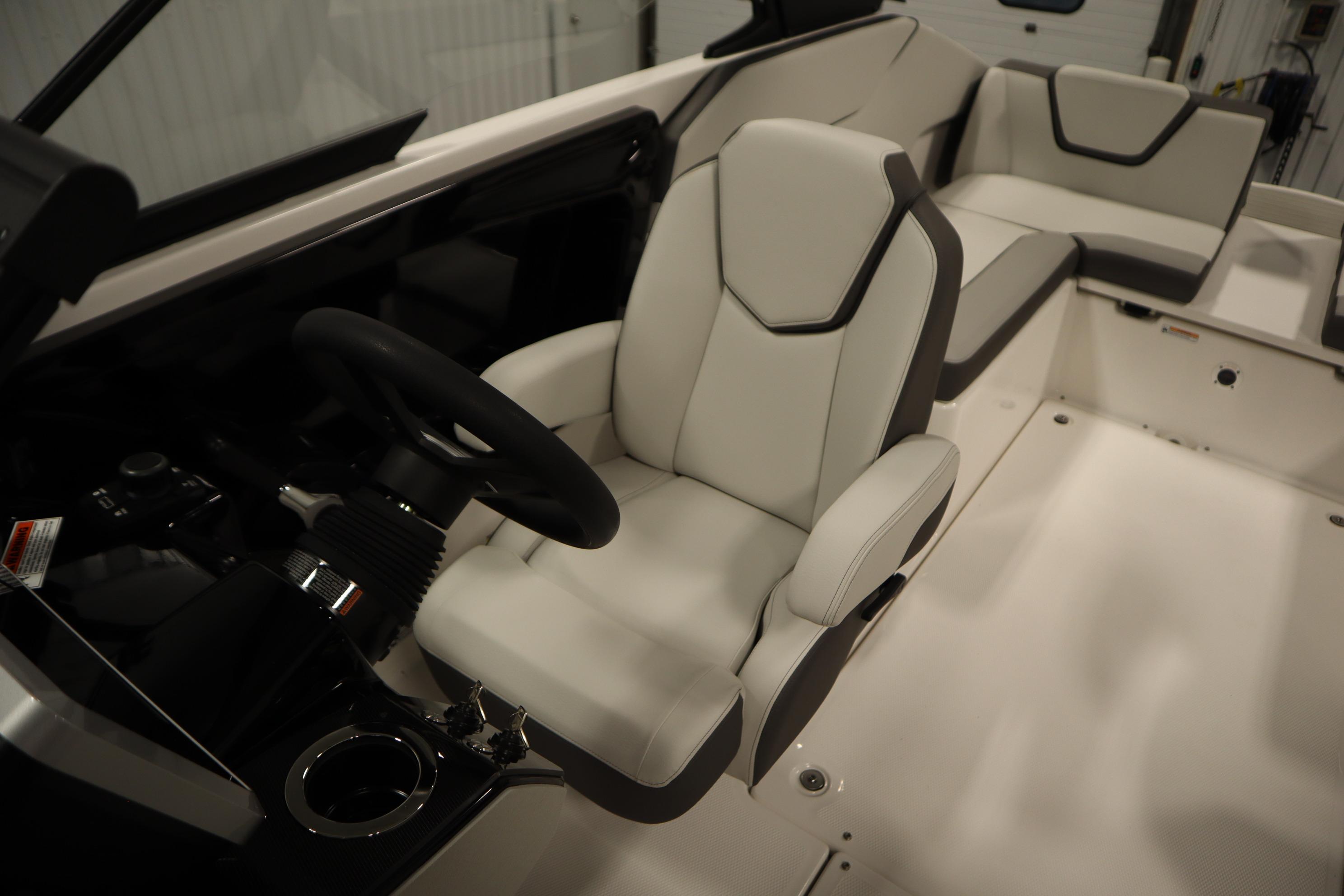 2026 Yamaha Boats AR250 interior with sleek white seating and modern steering console.