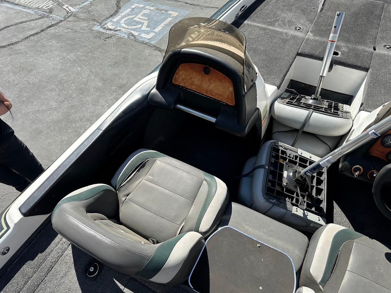 1999 Fisher 21 FX DC boat interior with seating and steering components.
