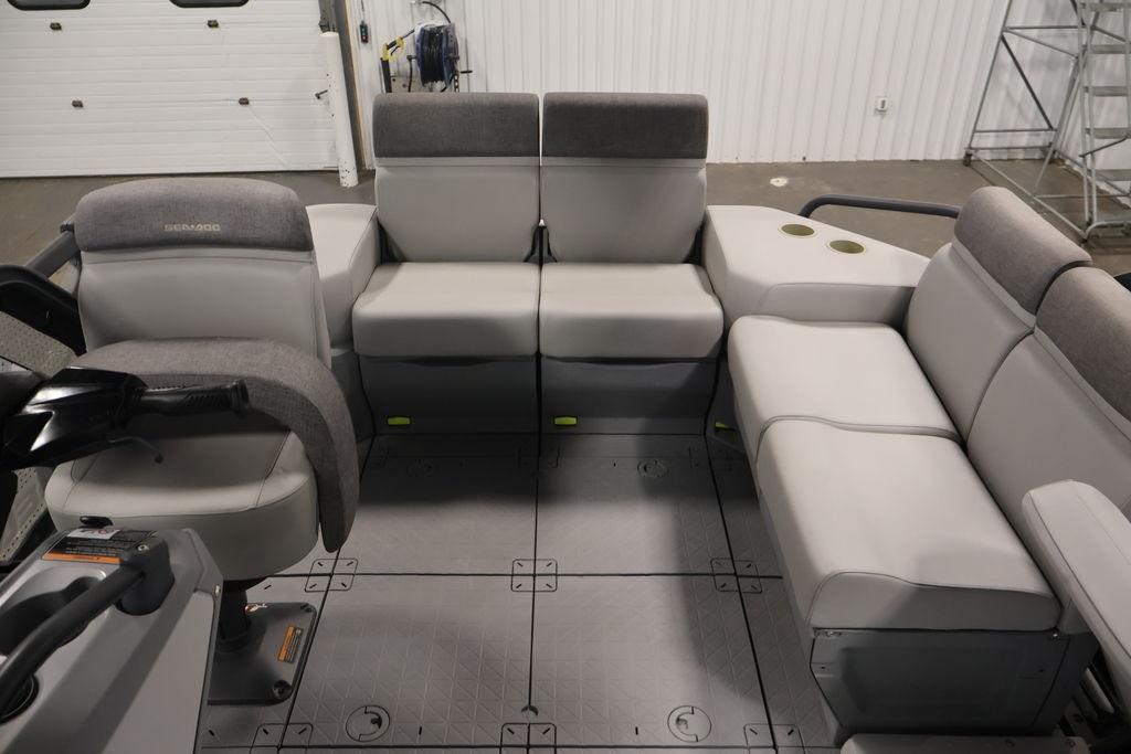 2023 Sea-Doo Switch Sport Compact interior with gray seating and steering console.