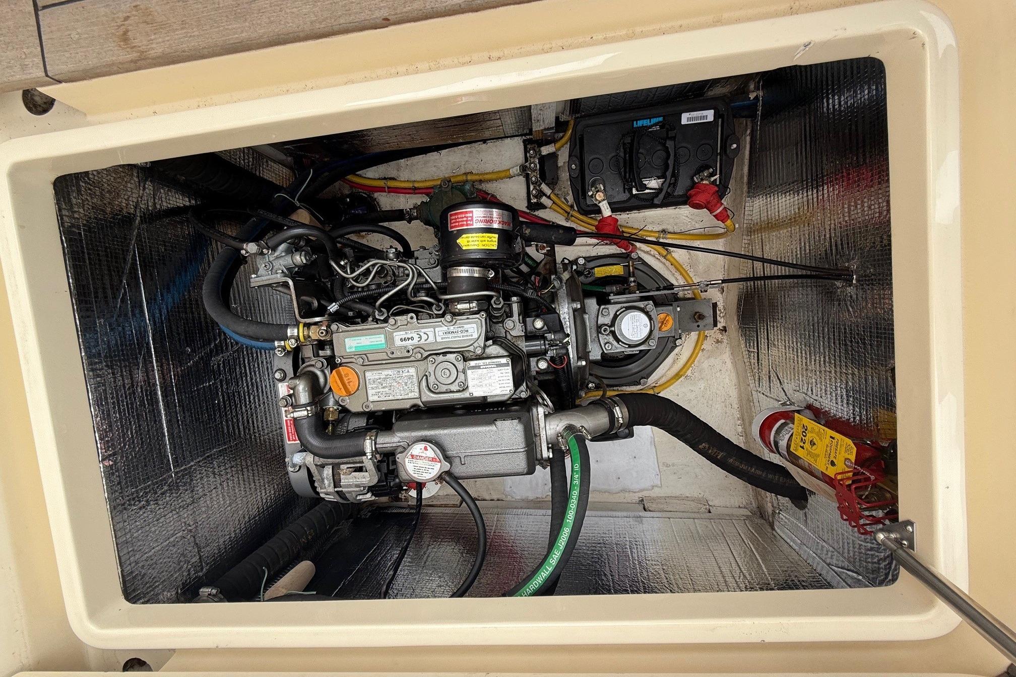 Engine compartment of a 2015 Hinckley DS 42 boat, showcasing detailed mechanical components.