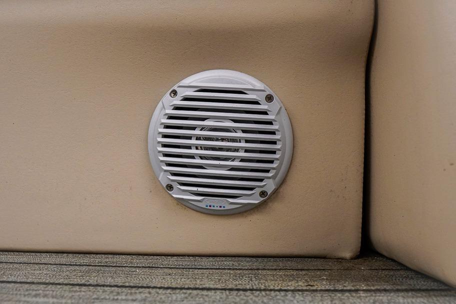 White speaker on beige surface of 2012 Xcursion X21C boat.