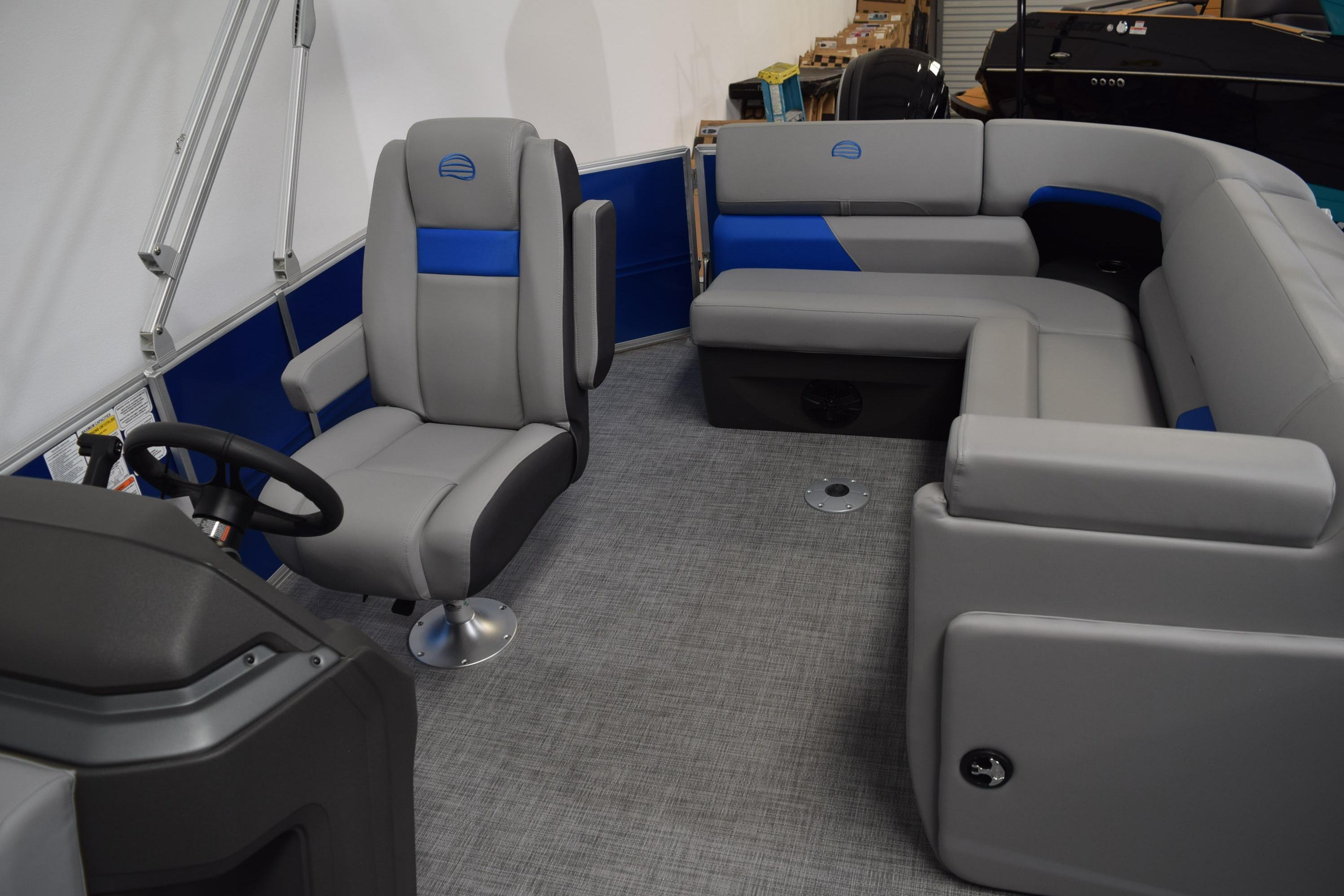 Interior of 2026 Sun Tracker Party Barge 20 DLX with gray and blue seating.