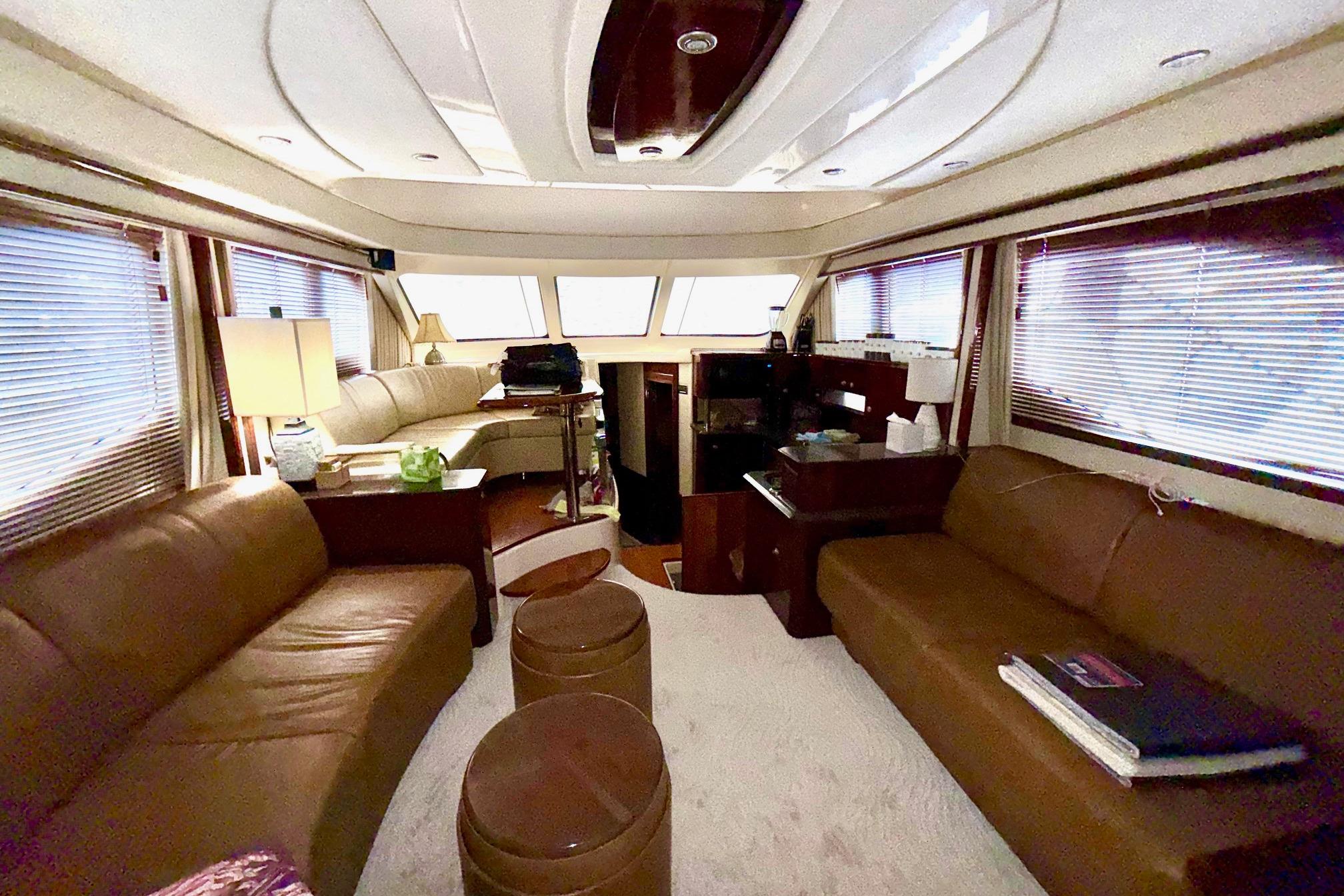 Luxurious interior of 2007 Sea Ray 52 Sedan Bridge yacht with leather seating and elegant decor.