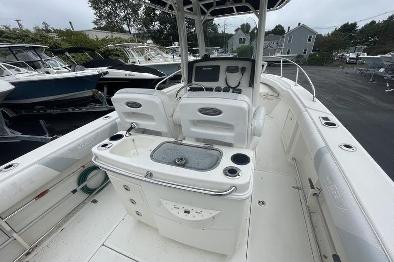 2012 Boston Whaler 250 Outrage boat interior with helm and seating area.