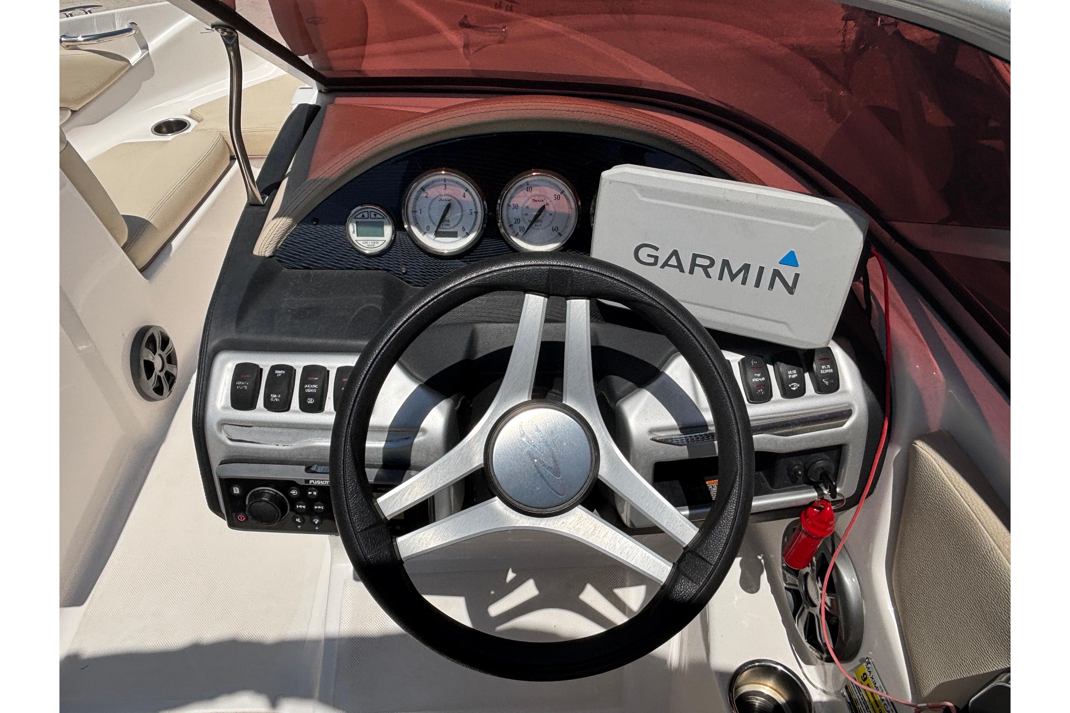2018 Regal 1900 ES Bowrider dashboard with Garmin navigation system and steering wheel.