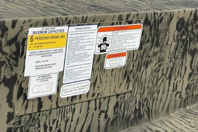2026 Tracker Grizzly 1754 Utility boat capacity and safety warning labels.