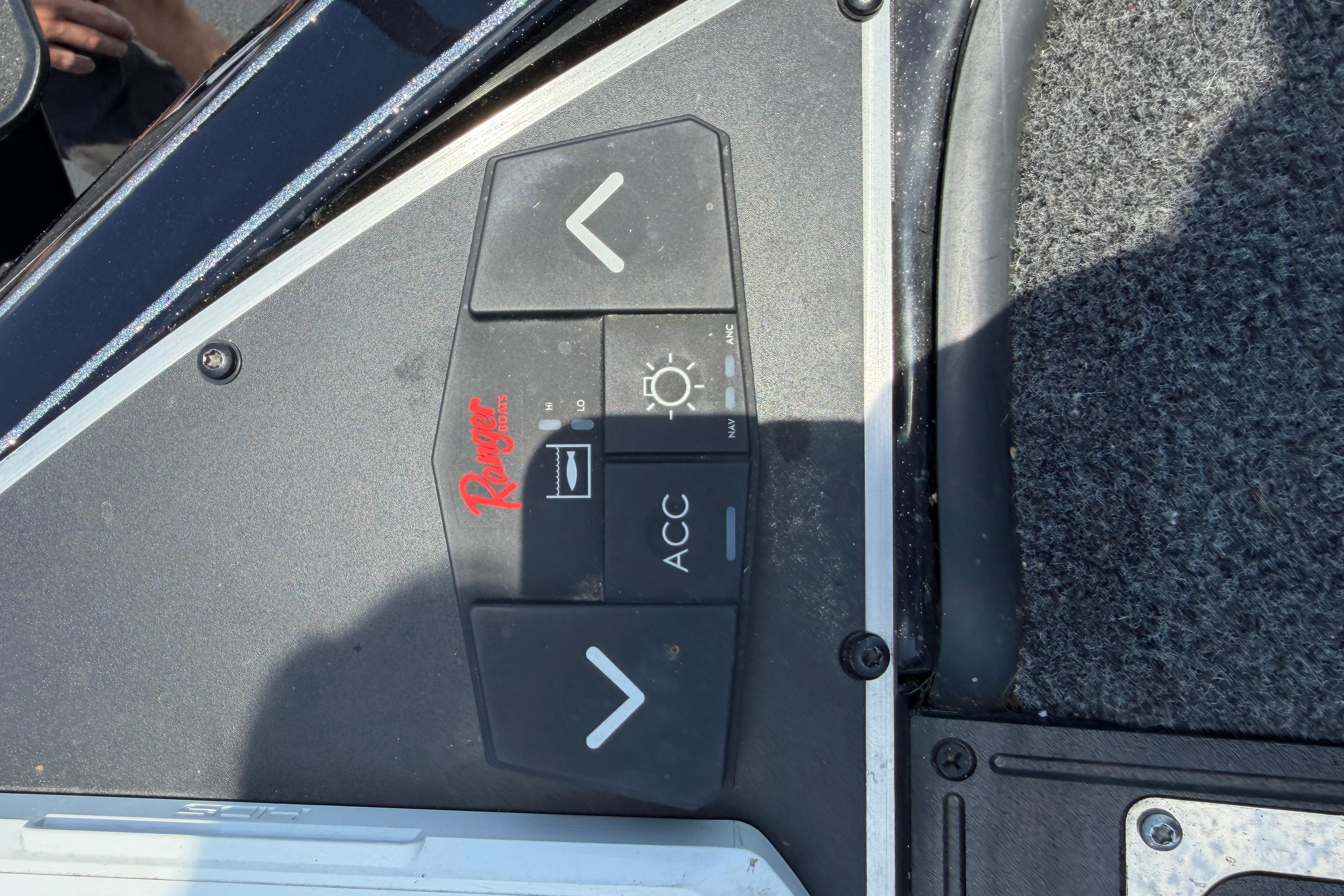 Control panel of 2023 Ranger Z520R boat with navigation and accessory buttons.