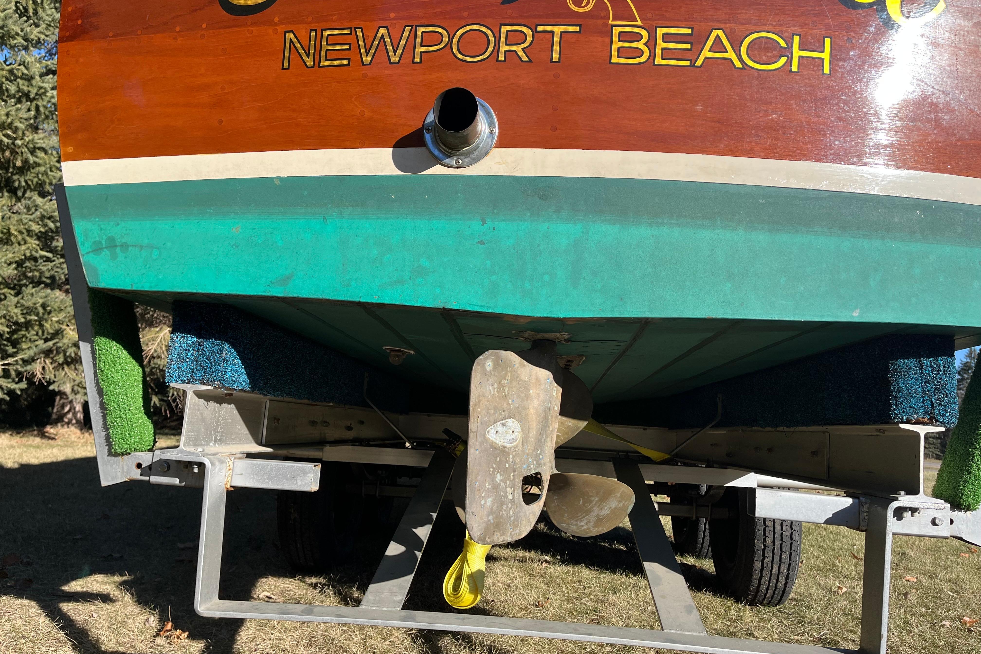 Rear view of 1938 Chris-Craft 28 Sportsman boat on trailer, Newport Beach.