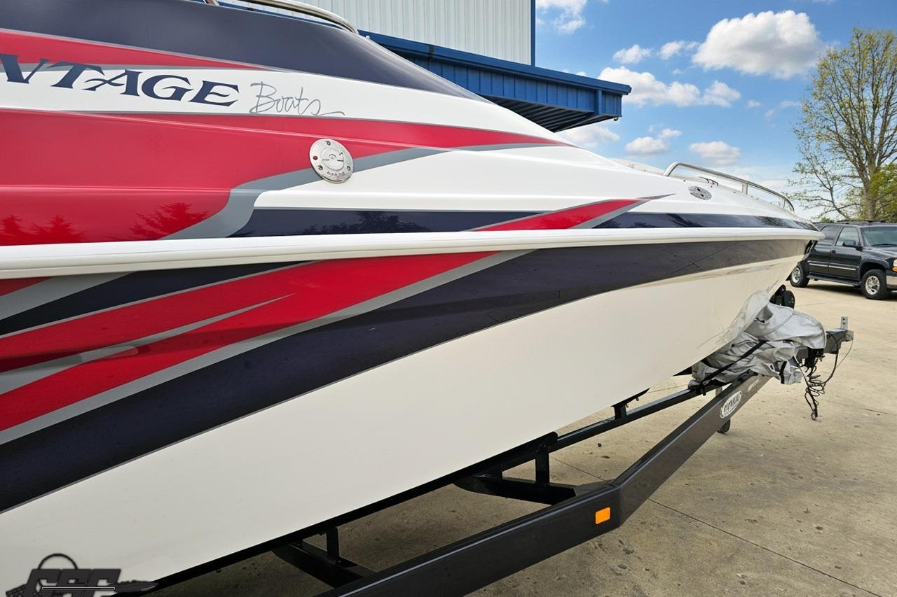 2019 Advantage 25 Citation Bowrider boat with red, white, and blue design on trailer.