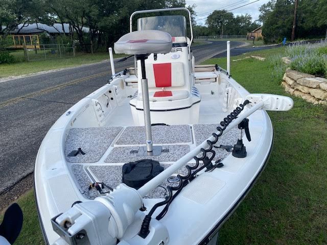 2012 Skeeter ZX200 boat with red seat and fishing gear.