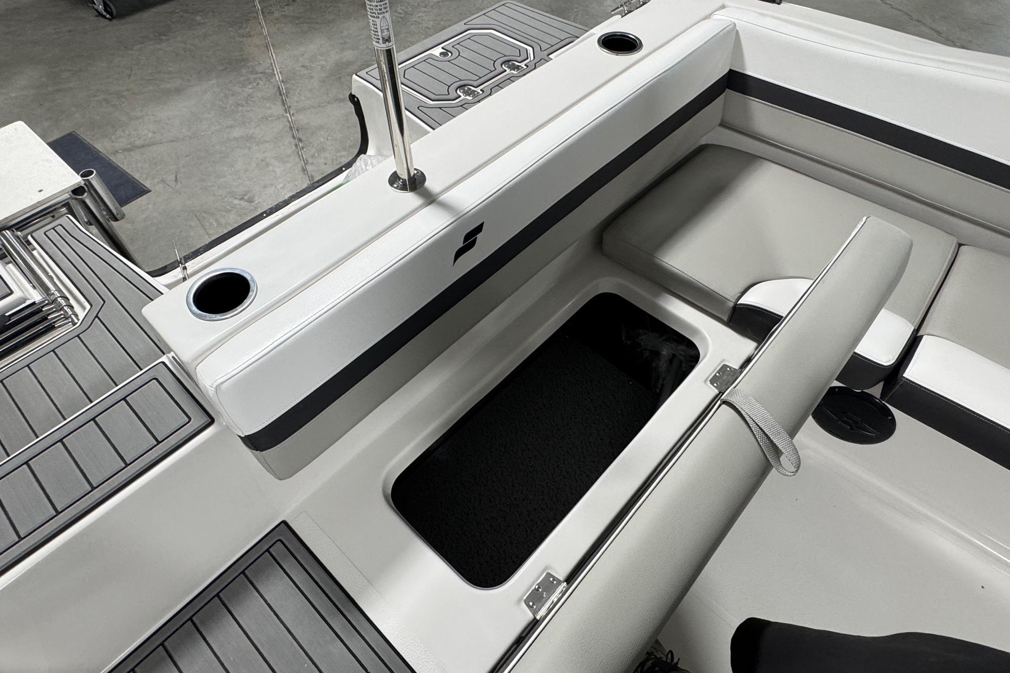 Interior of 2026 Starcraft SVX 191 OB boat, featuring seating and storage compartment.