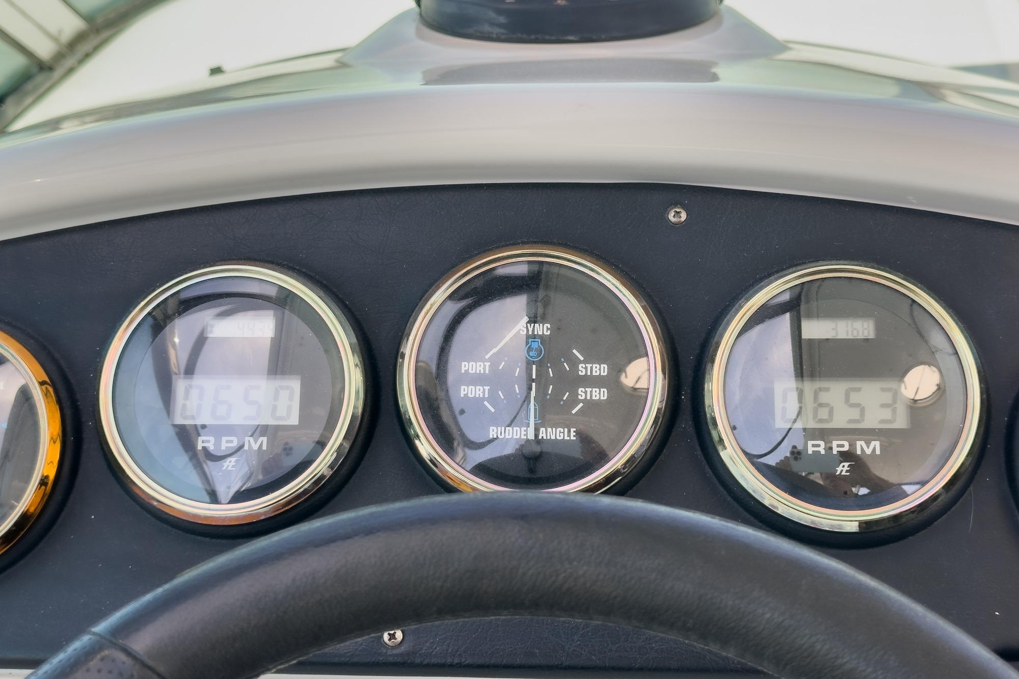 Dashboard gauges of a 2003 Carver 530 Voyager Pilothouse boat.