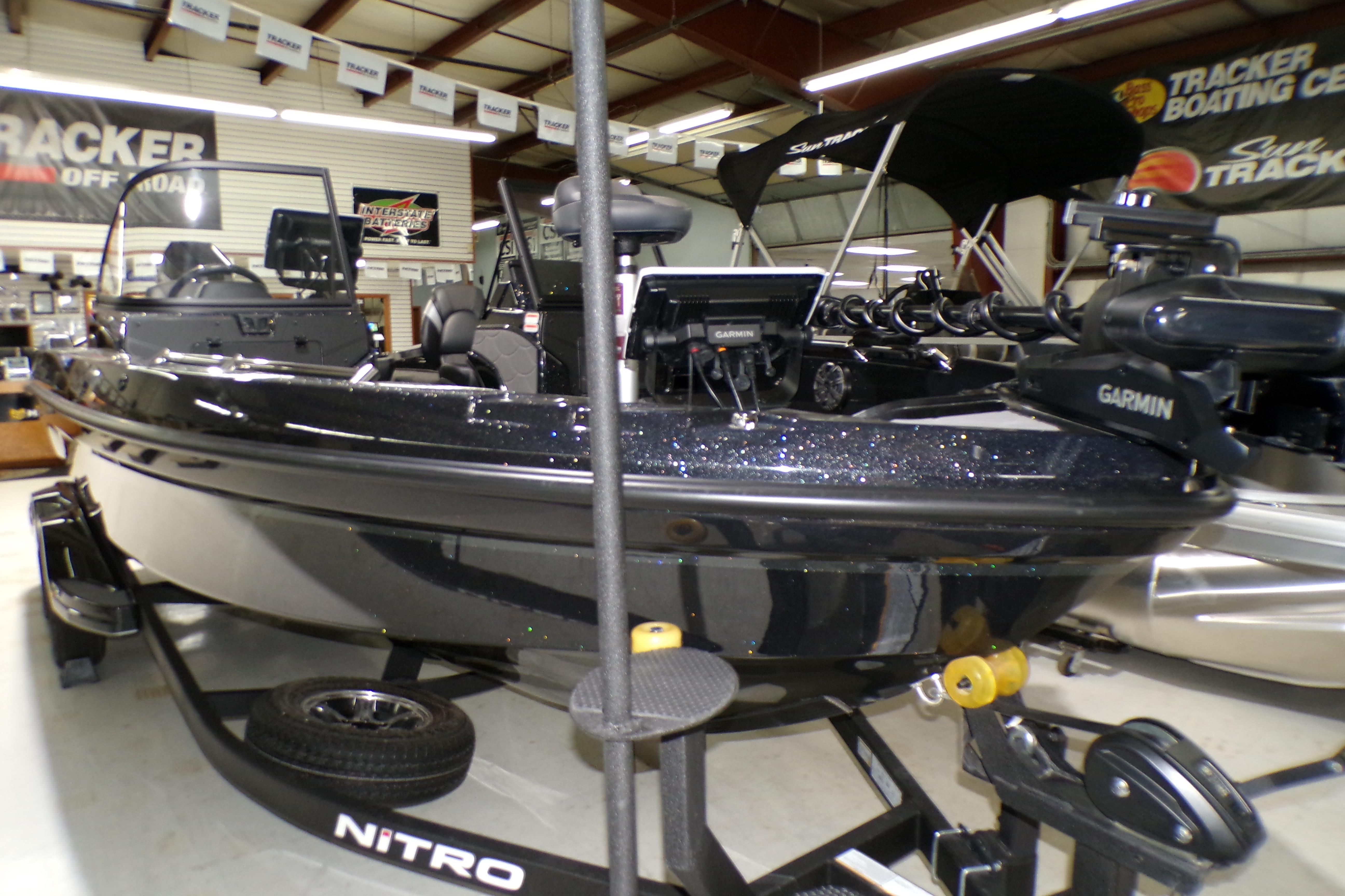 2026 Nitro ZV21 Pro boat in showroom, featuring Garmin equipment and sleek design.