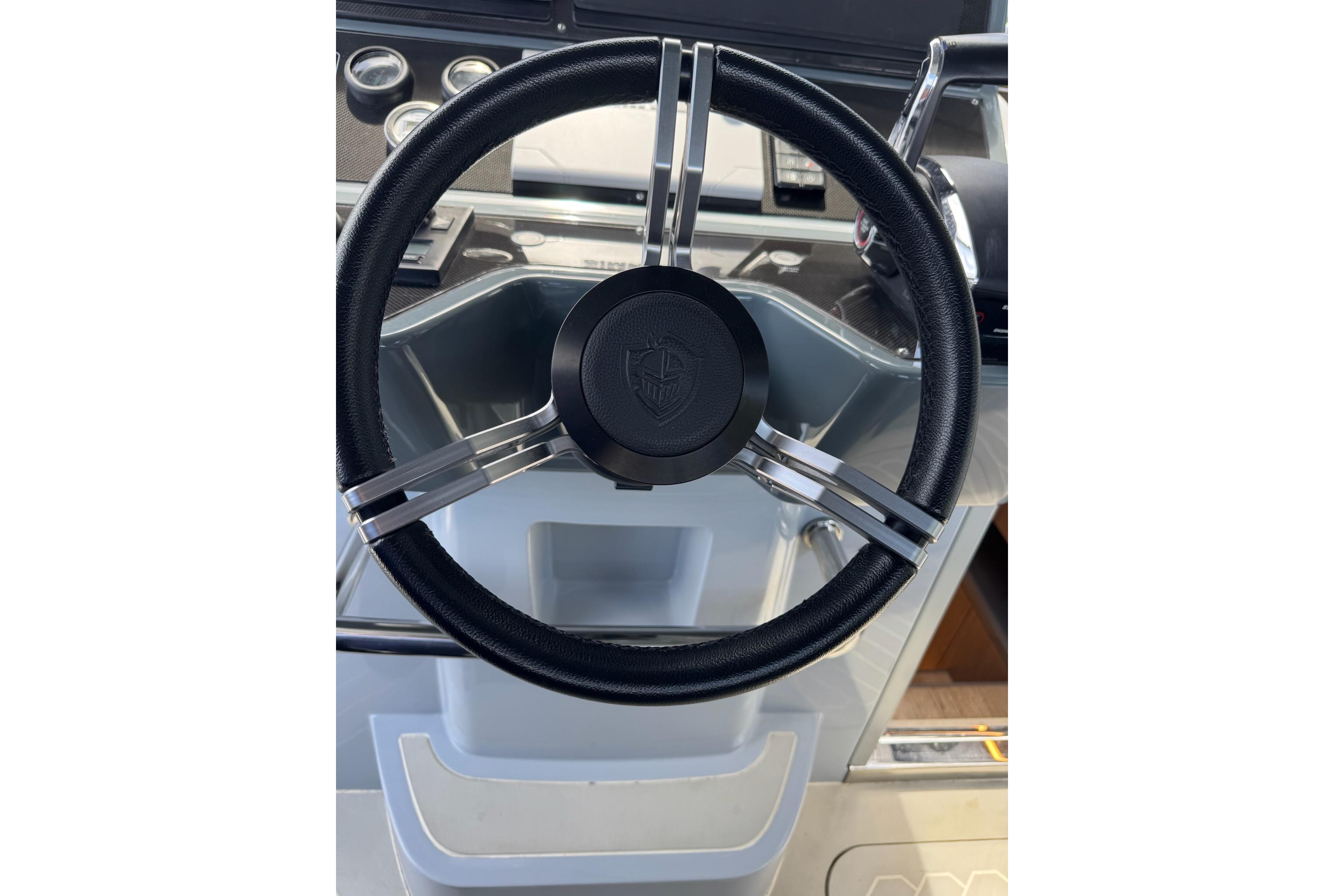 Steering wheel of 2023 Canados 431 yacht, featuring sleek design and modern controls.