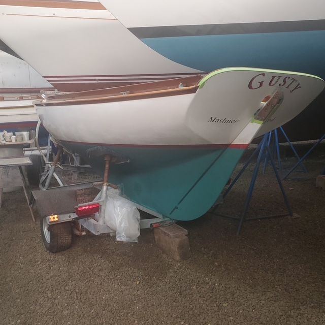 2003 Herreshoff 12.5 sailboat on trailer in dry dock.