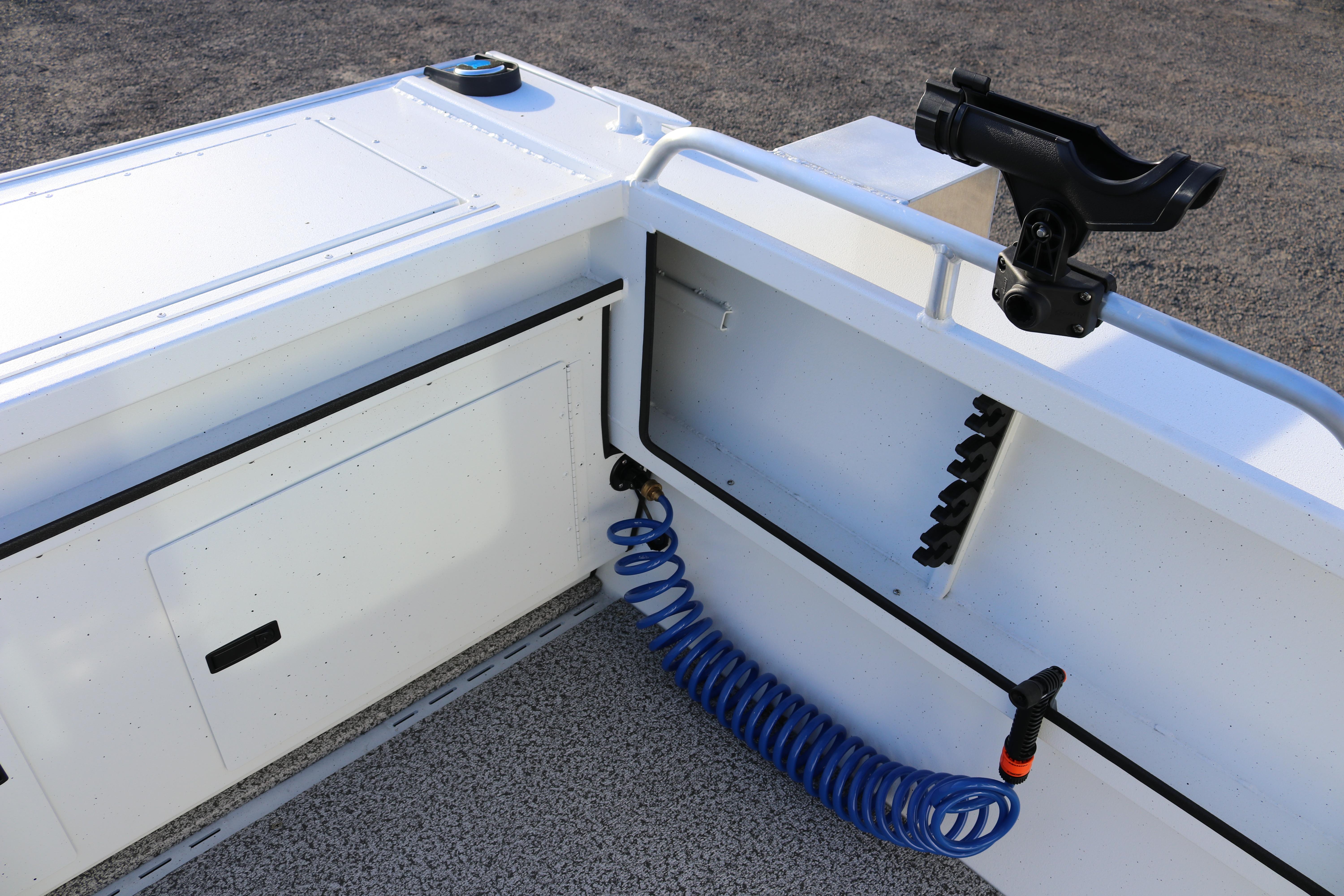 2026 Alumaweld Intruder Outboard 22 boat interior with rod holder and coiled hose.