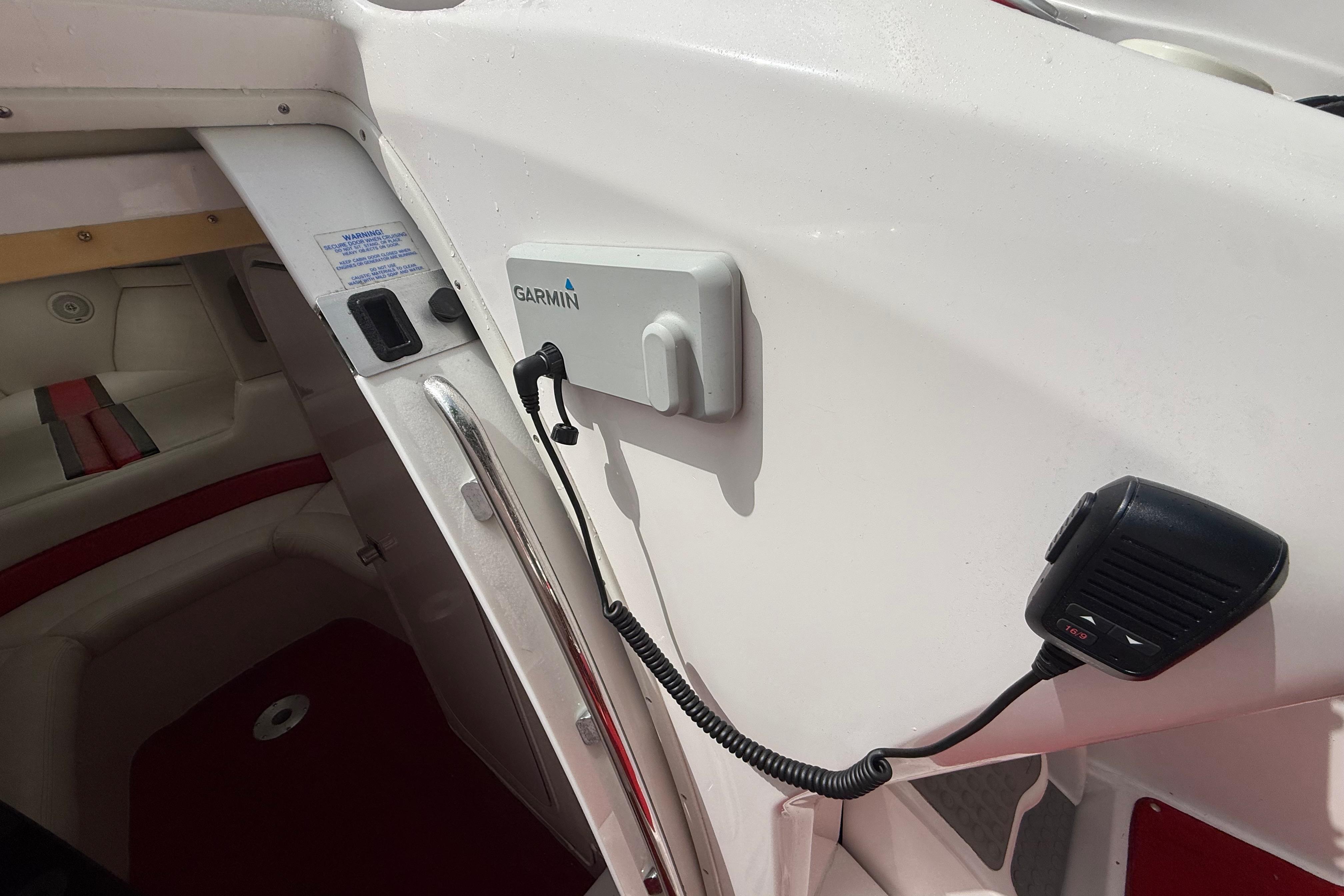 Interior of a 1998 Donzi 33 ZX boat featuring Garmin equipment and communication device.