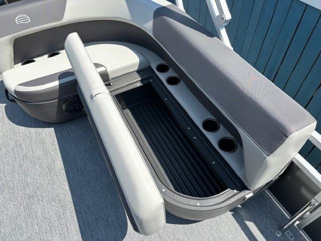 2026 Sun Tracker Bass Buggy 18 DLX boat seating with storage and cup holders.