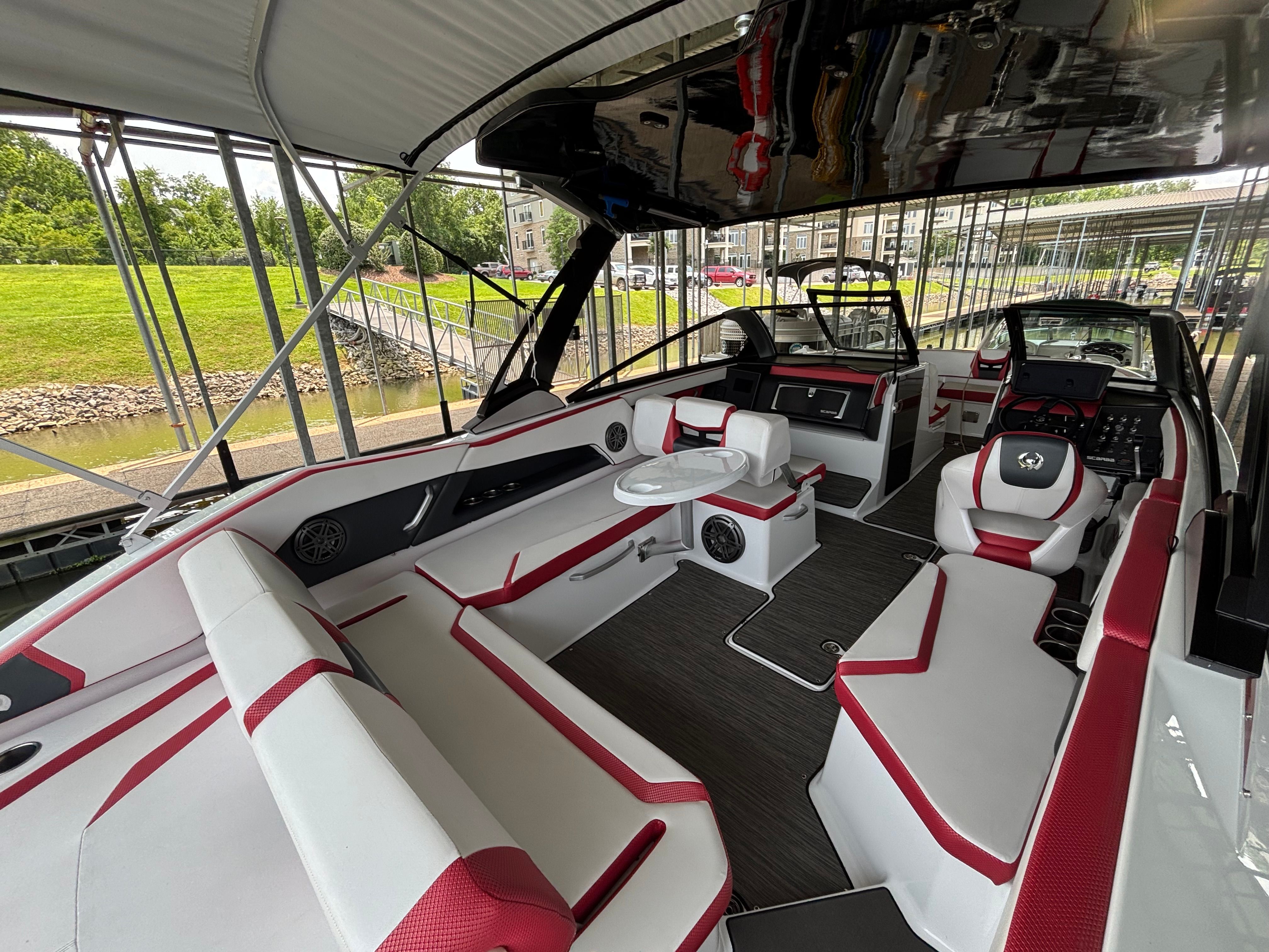 Interior of a 2021 Scarab 285 ID boat in a dock.