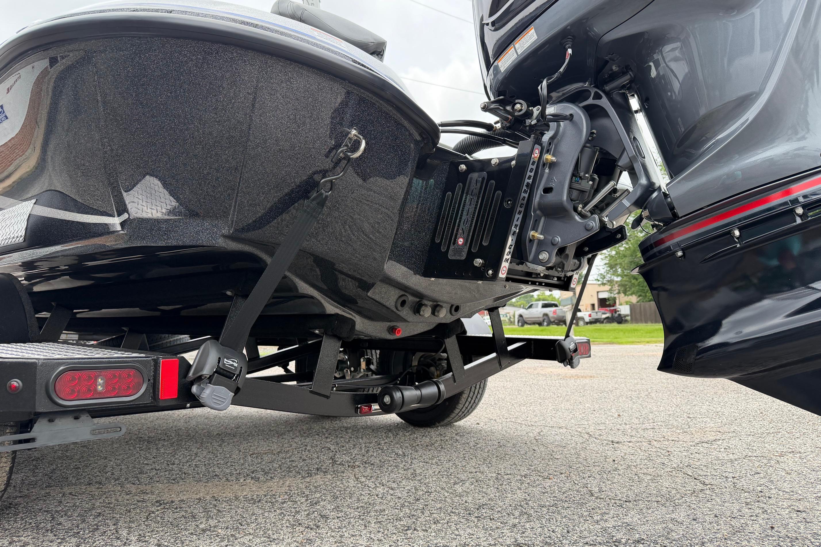 Rear view of a 2027 Falcon F20 PREDATOR boat on a trailer.