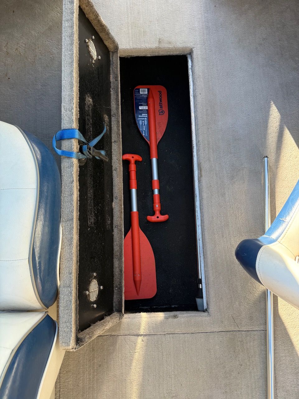 Crownline 192 BR boat storage compartment with paddles, year 2000.
