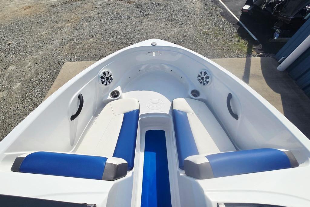 2018 Tahoe 450 TS boat interior with blue and white seating and speakers.