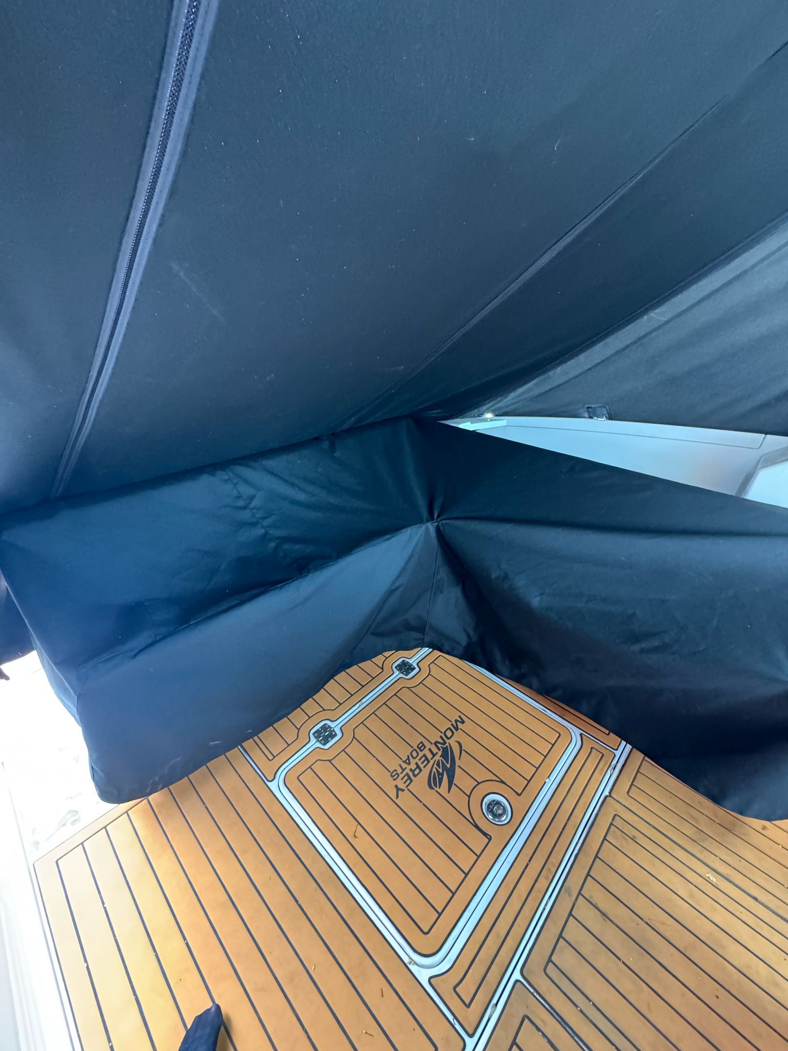 2015 Monterey 360 Sport Coupe with wooden deck and black canopy.