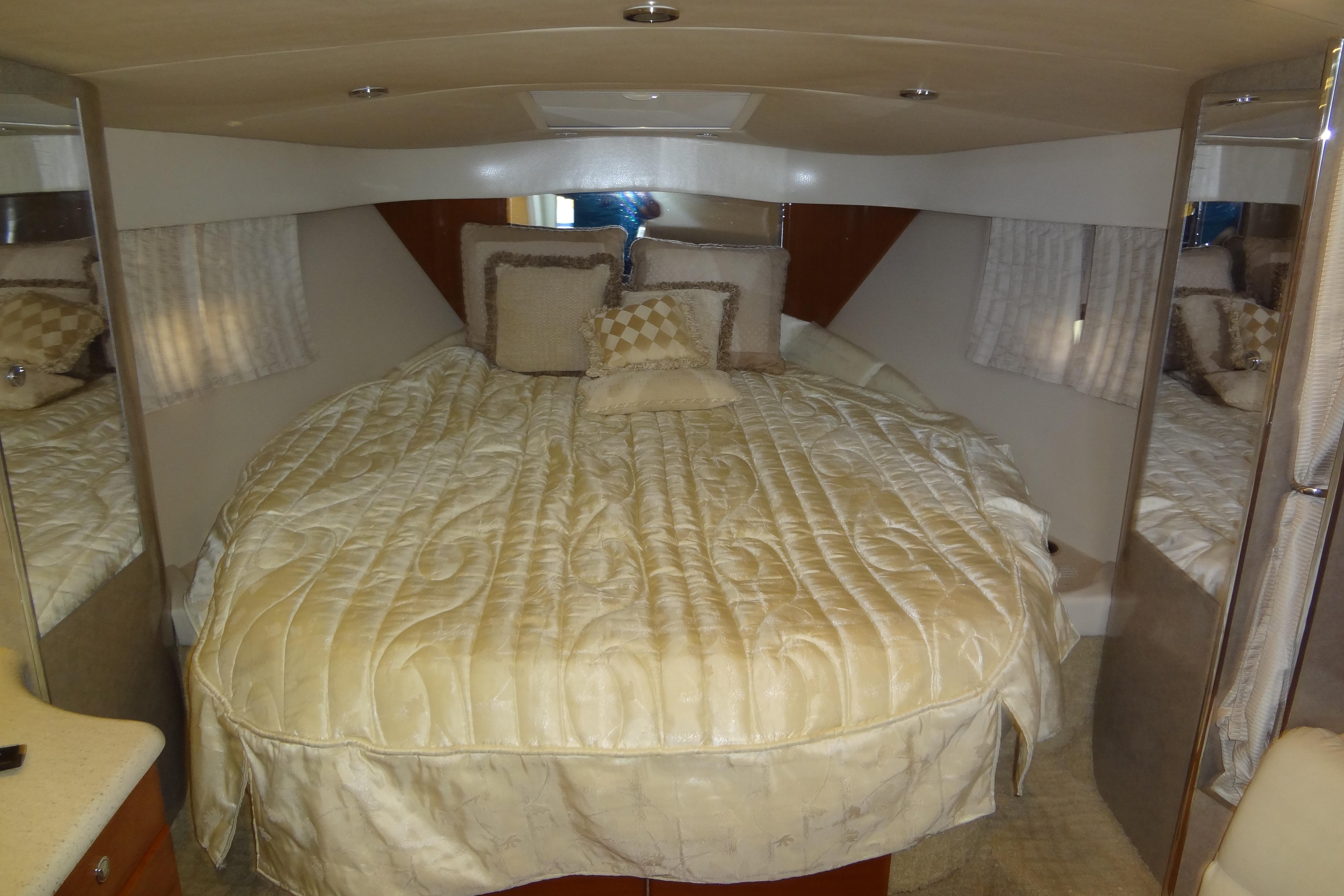 Luxurious cabin interior of 2007 Formula 34 Performance Cruiser with plush bedding.