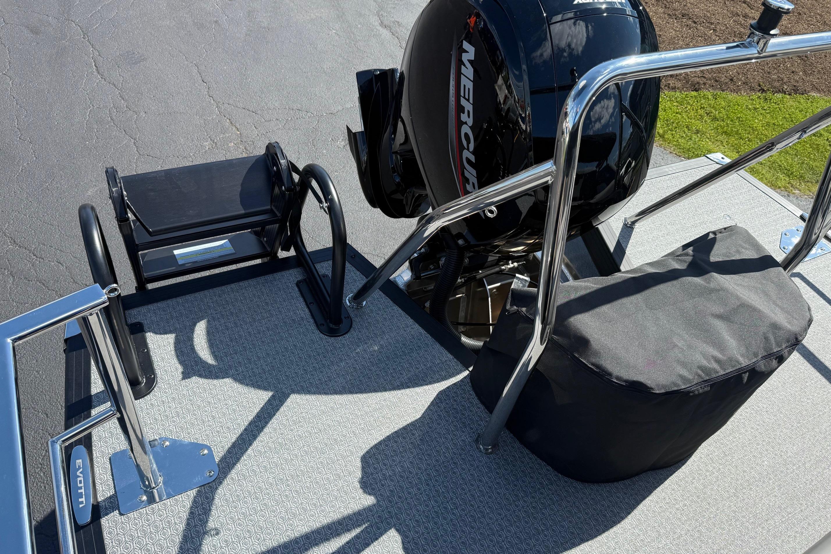 2026 Evotti 521CS boat deck with Mercury engine and stainless steel railings.