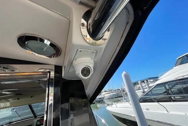 2016 Sea Ray Sundancer 510 yacht interior with security camera and marina view.