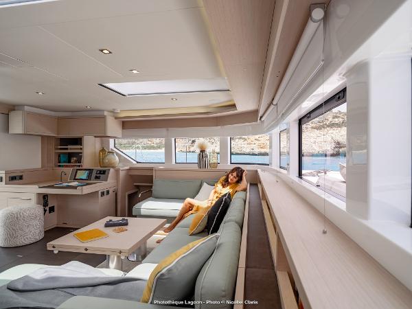 Luxurious interior of 2025 Lagoon 55 yacht with modern furnishings and scenic views.