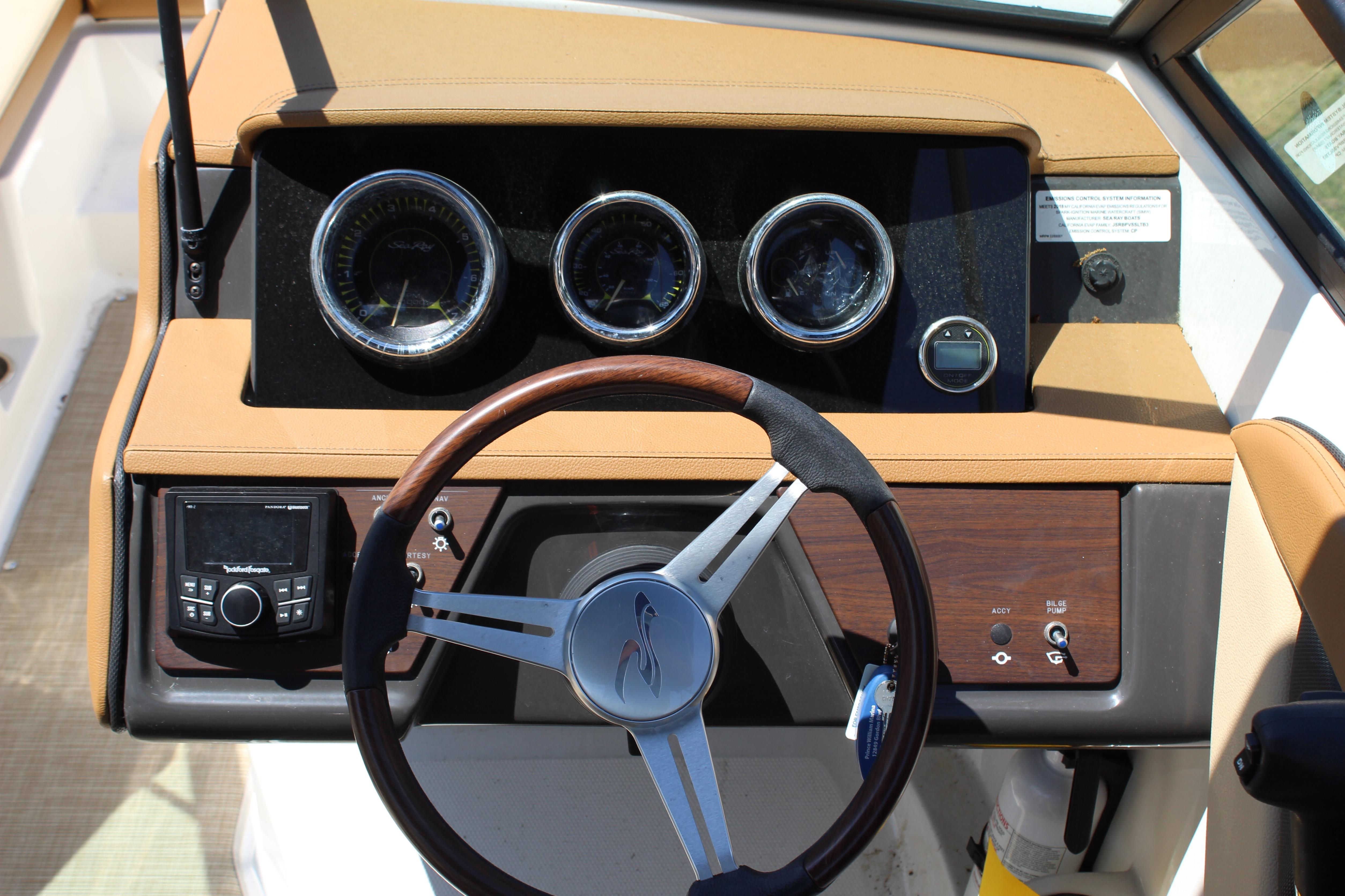 2018 Sea Ray SPX 190 Outboard dashboard with gauges and steering wheel.