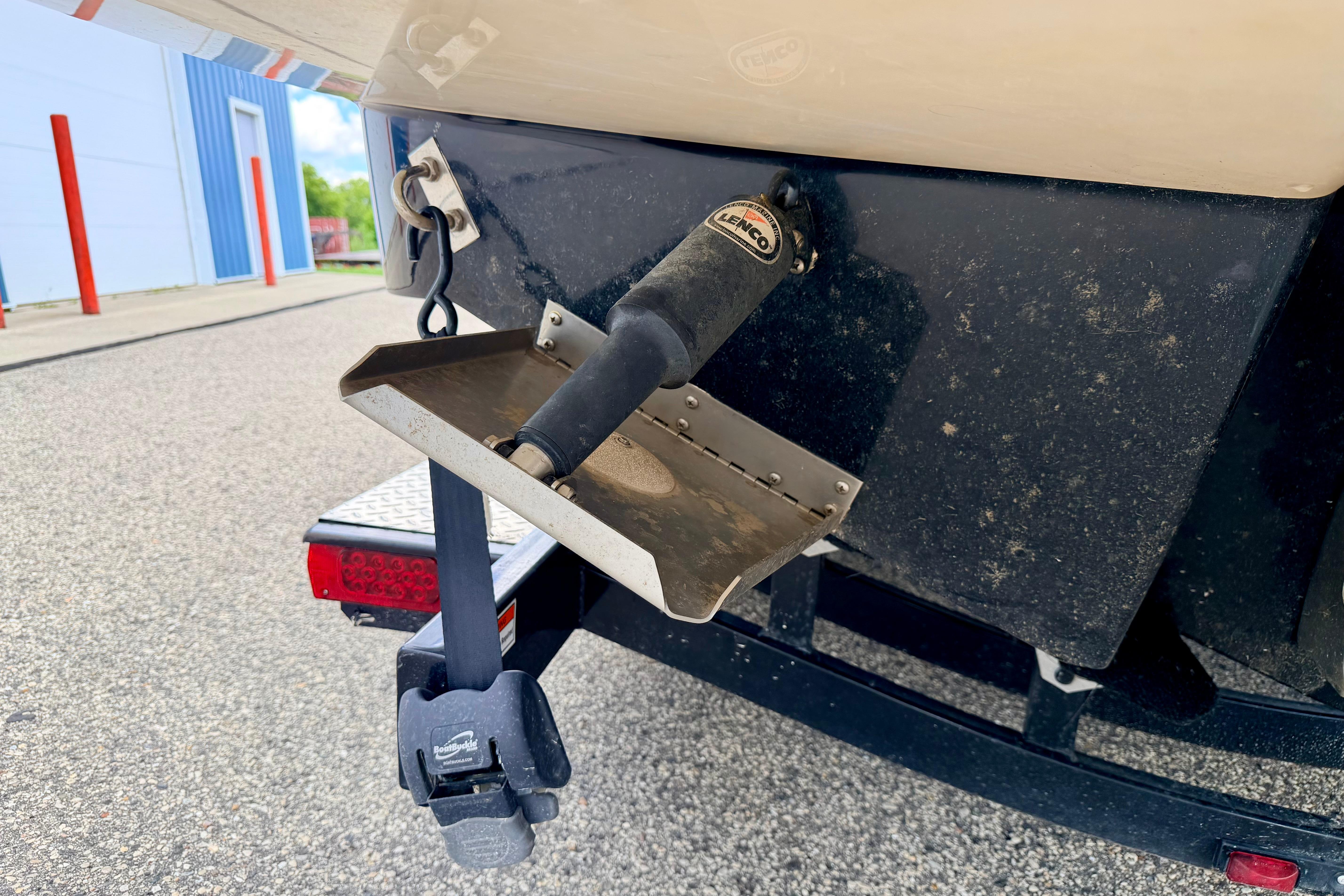 2015 Chaparral Sunesta 264 boat trailer with trim tab and hitch detail.
