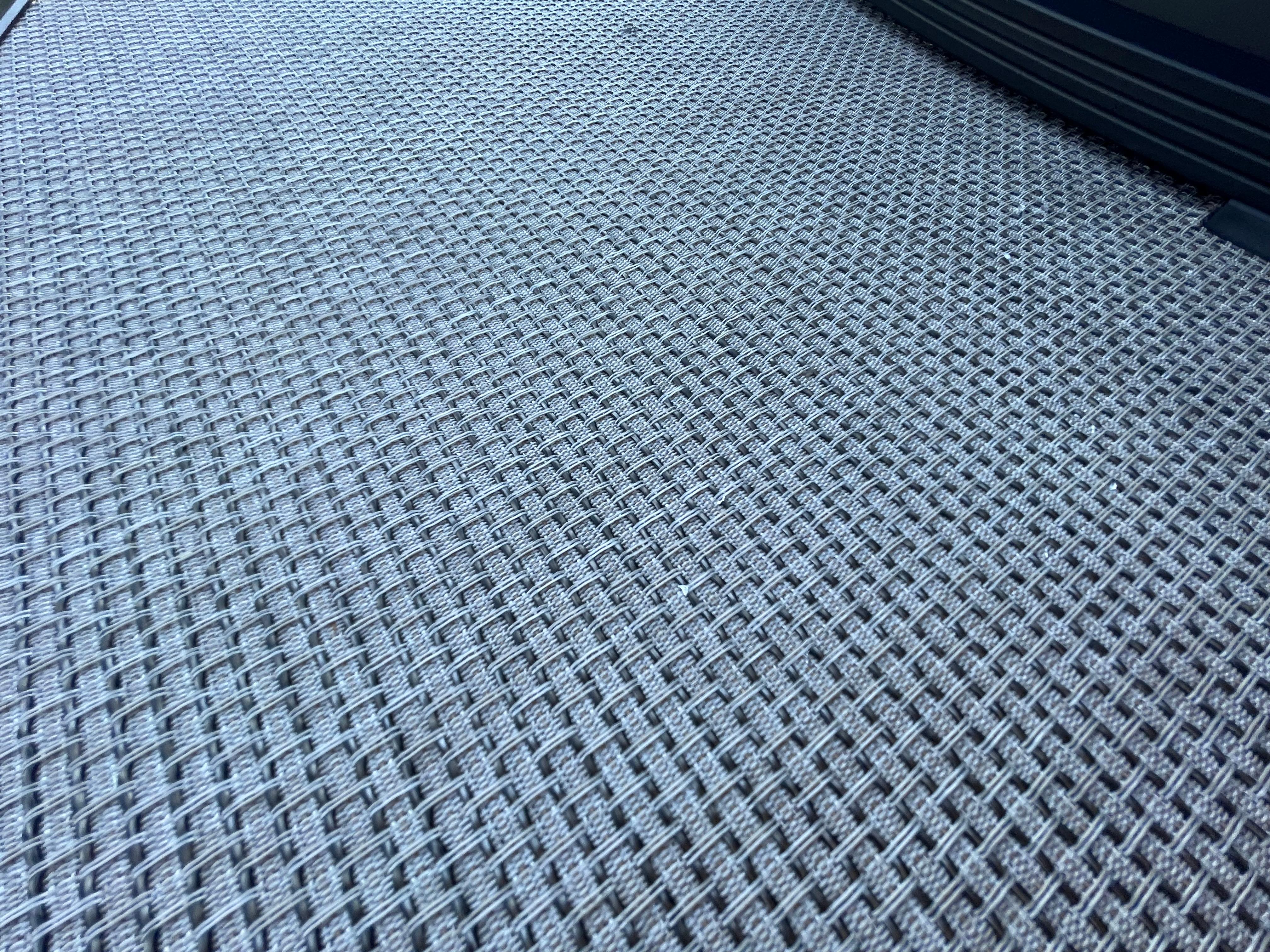 Woven texture detail on 2026 Harris Solstice 230 boat flooring.