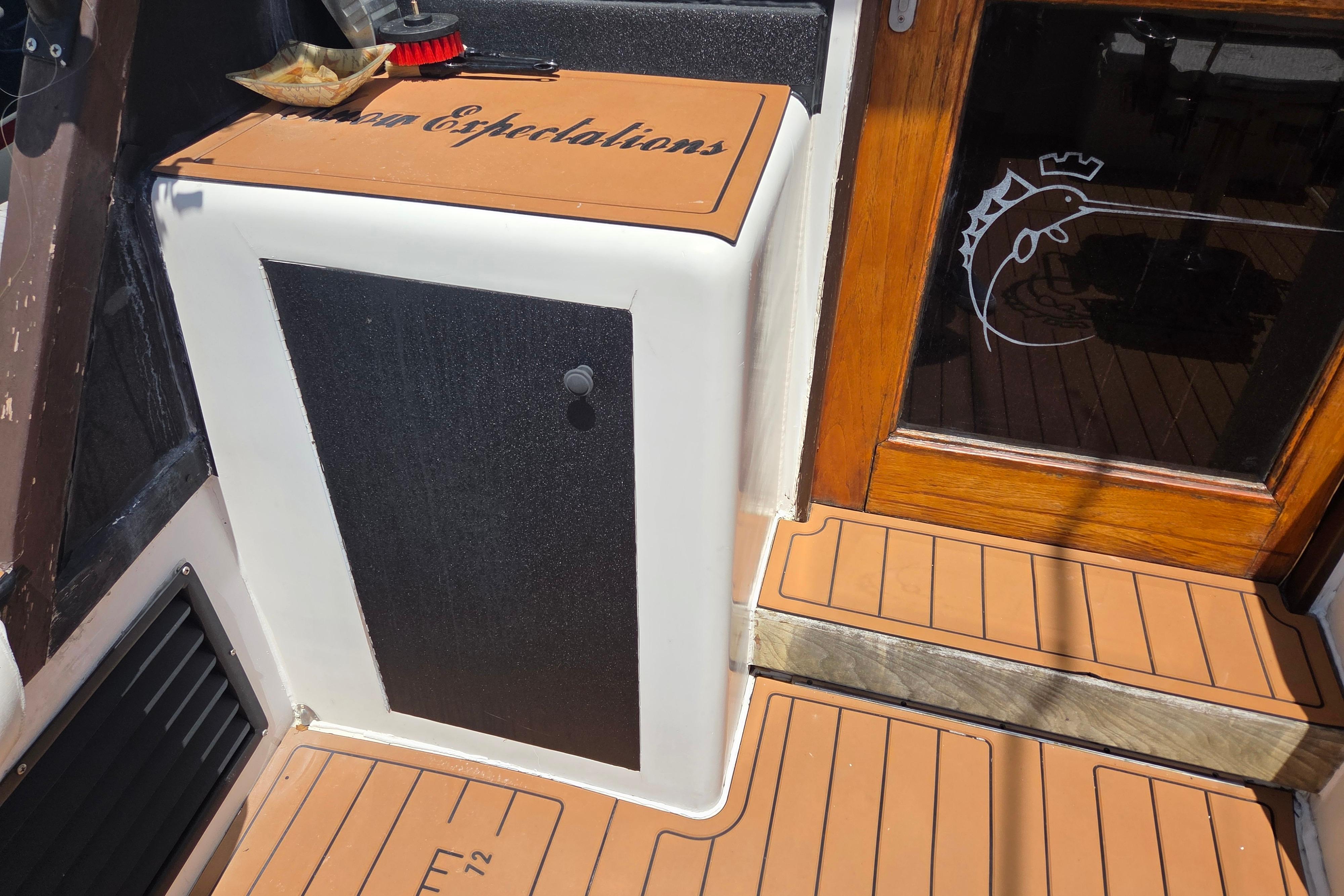 1990 Egg Harbor Golden Egg 42 boat interior with wooden accents and nautical decor.