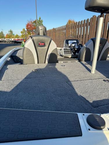 2025 Ranger ALPHA 208 boat interior with seating and deck, under clear blue sky.
