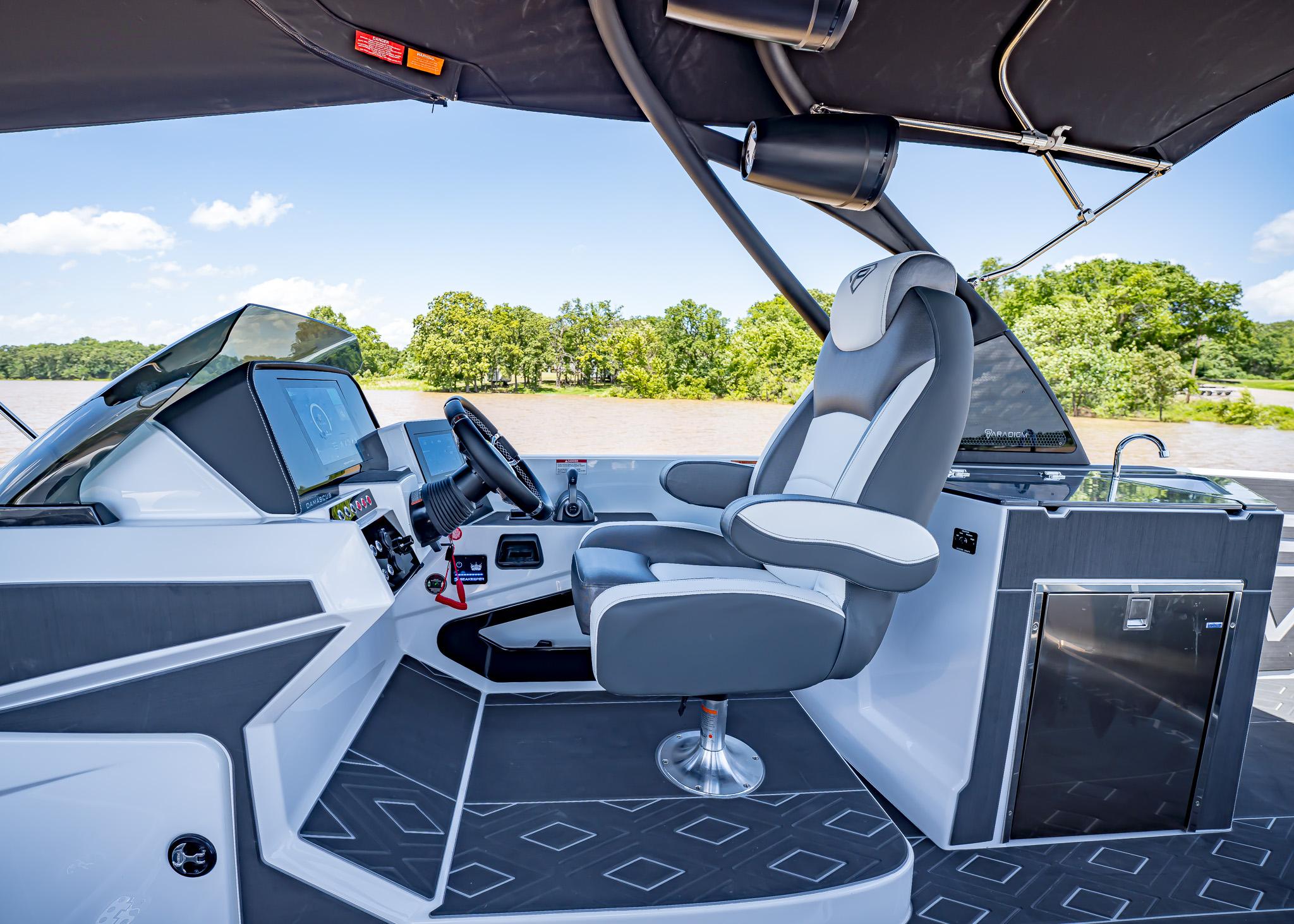 2025 Paradigm Damascus 266 Surf boat cockpit with modern controls and luxurious seating.