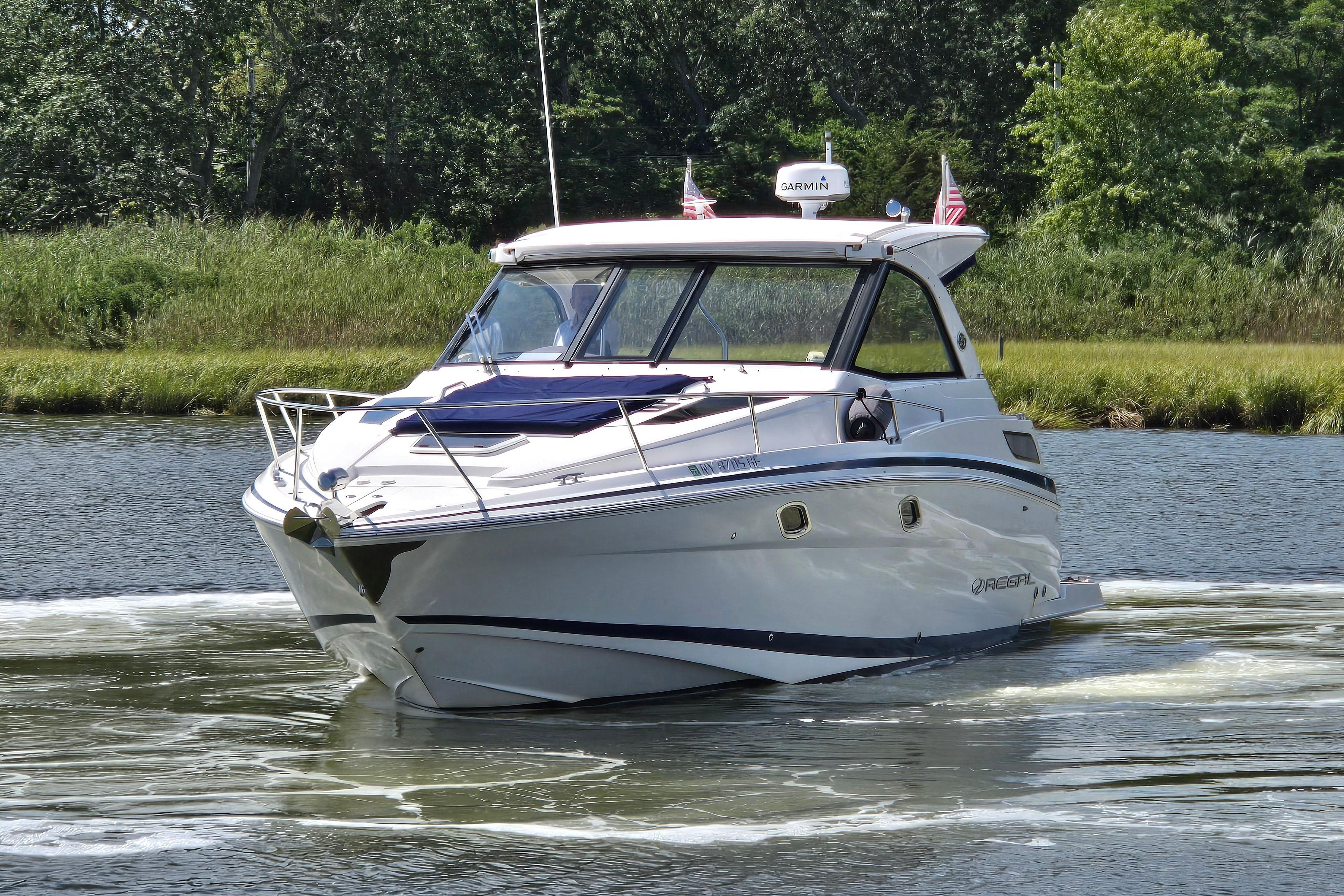 2018 Regal 35 Sport Coupe cruising on a scenic river.