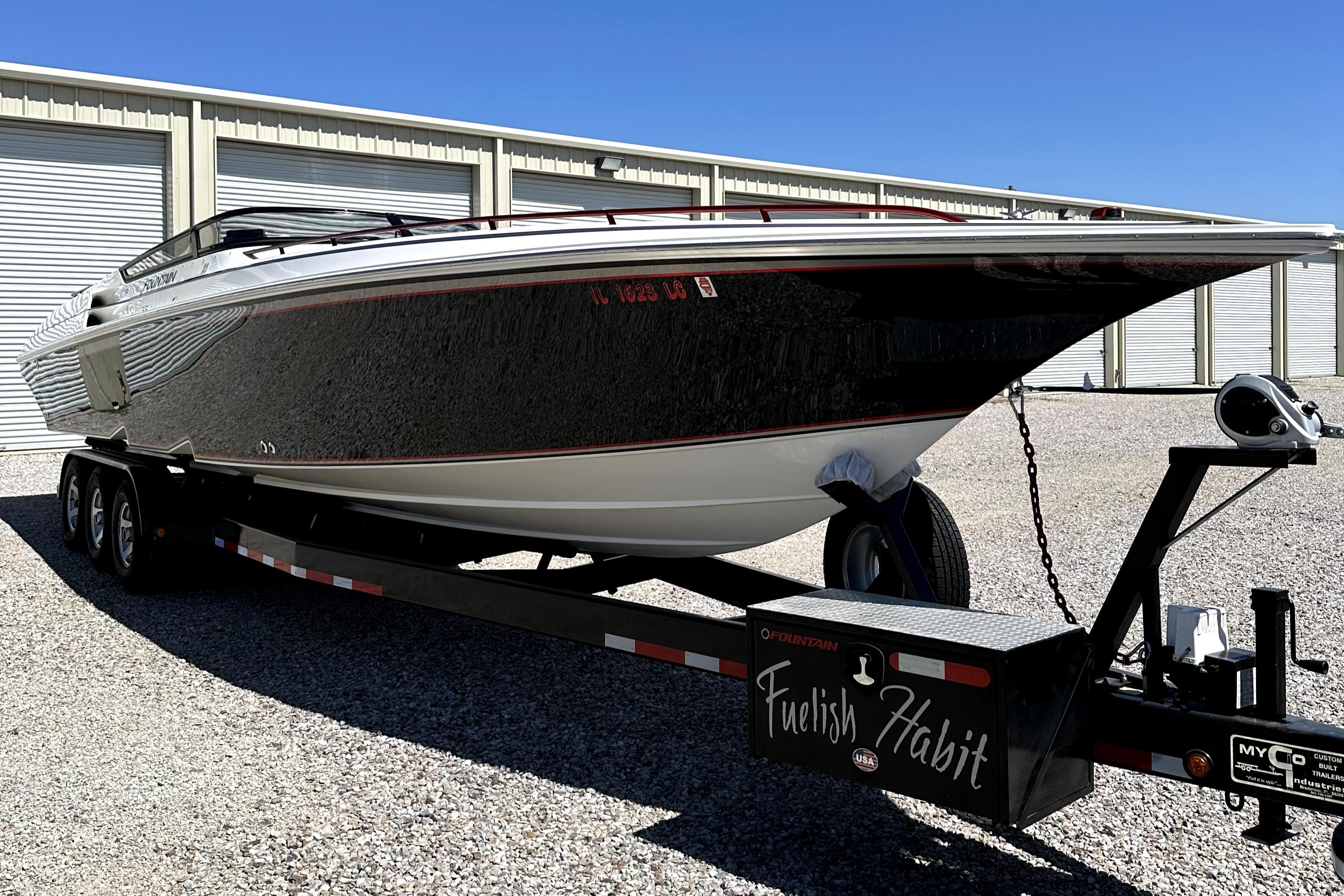 2003 Fountain 38 Lightning speedboat on a trailer in storage facility.