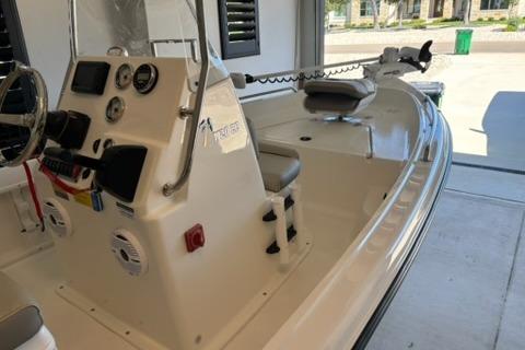 2024 Key West 1720 Center Console boat in a garage, showcasing steering and seating area.