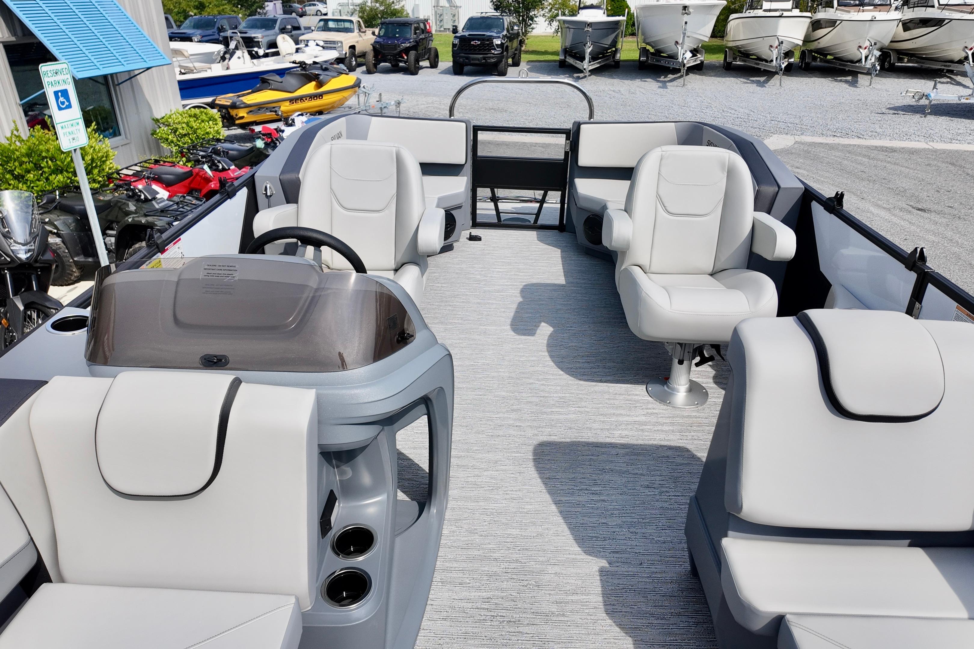 Interior of 2026 Sylvan A-20 LZ DH pontoon boat with plush seating and modern helm.