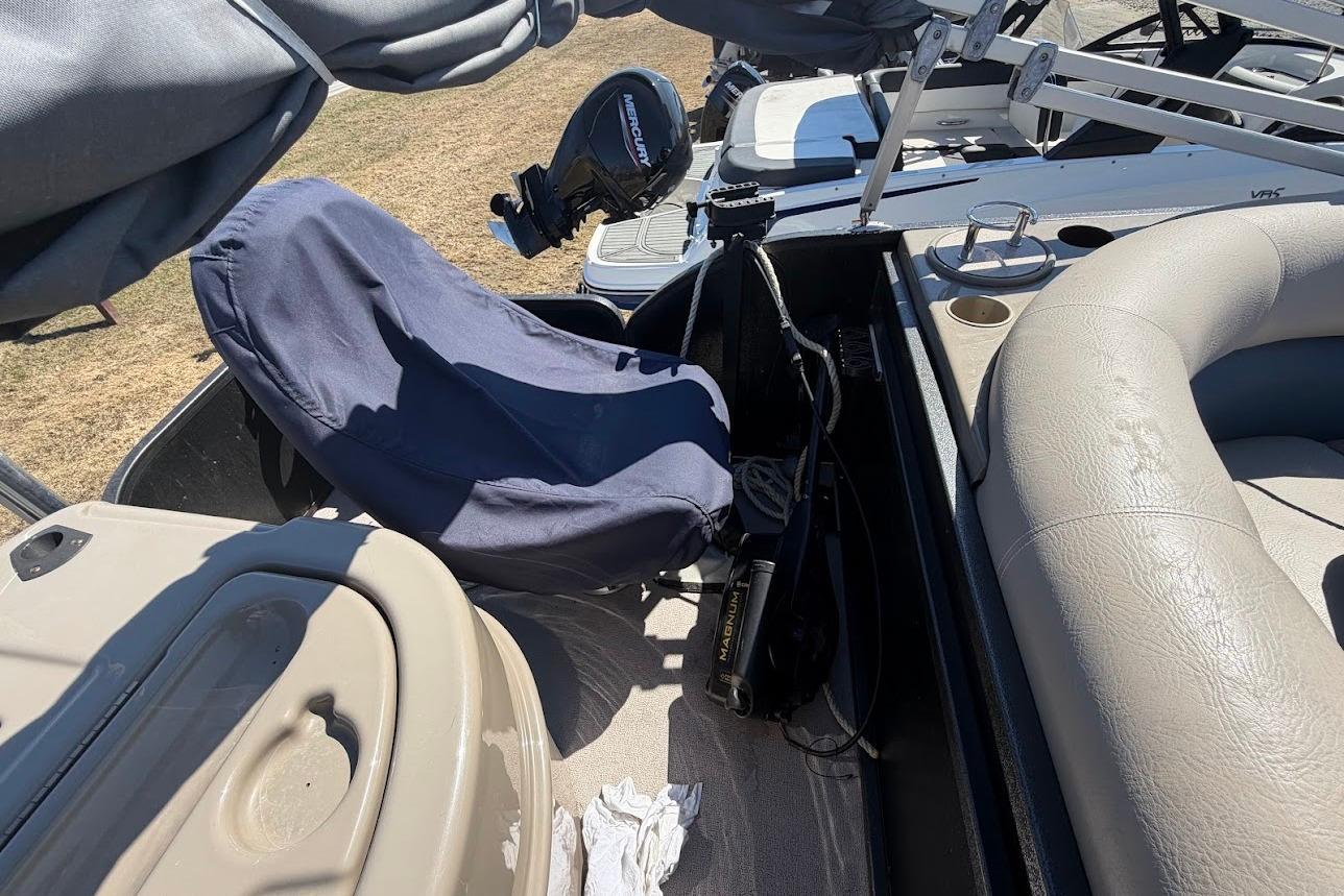 Interior of a 2013 Premier 221 Explorer boat with covered seating and equipment.