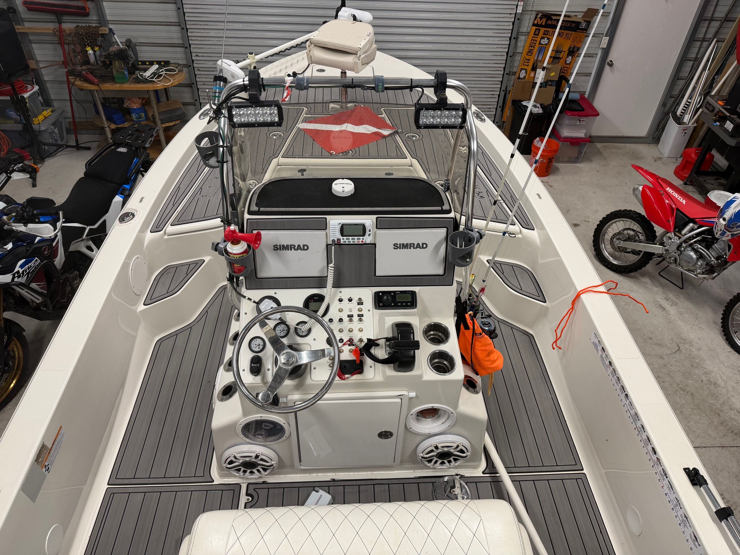 Interior view of a 2018 Ranger 2260 Bay Ranger boat in a garage.