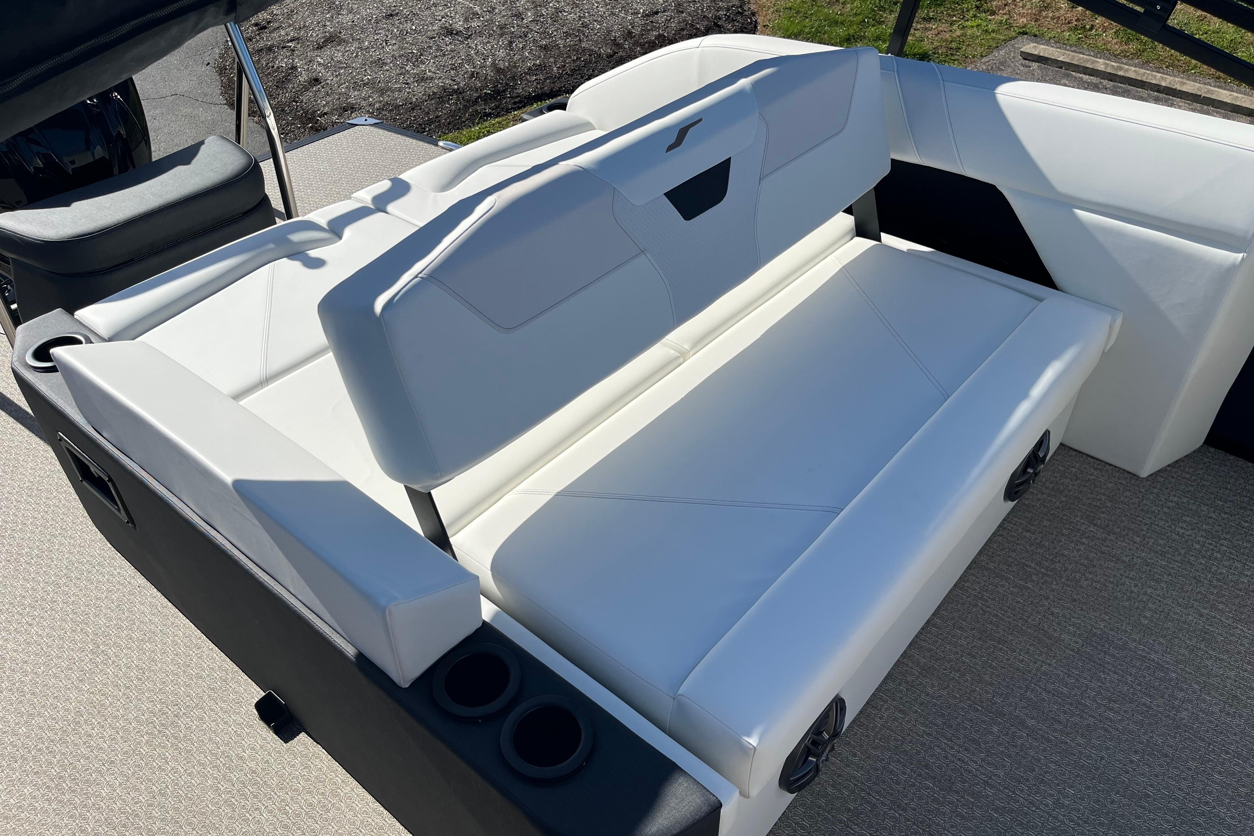 Luxurious white seating on 2026 Evotti 523CS boat, featuring cup holders and modern design.