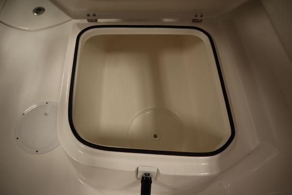 2025 Sea Fox 228 Traveler boat storage compartment, open and empty.
