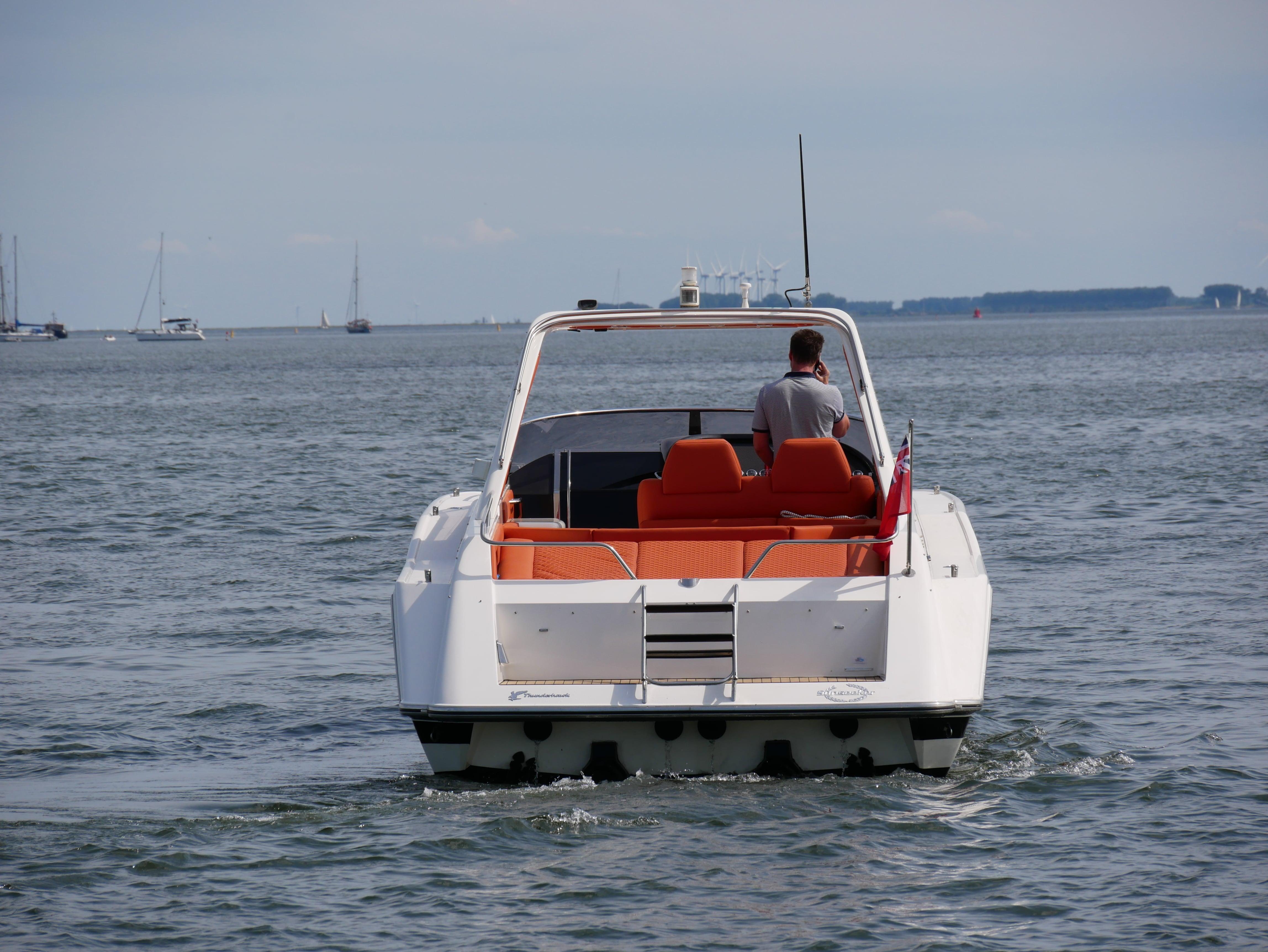 Sunseeker Thunderhawk 43, 1991 model, cruising on open water with orange seating.
