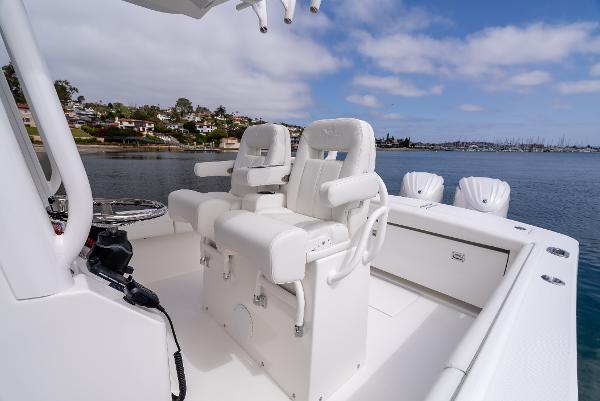 2025 Regulator 28 boat with luxurious seating on calm waters.